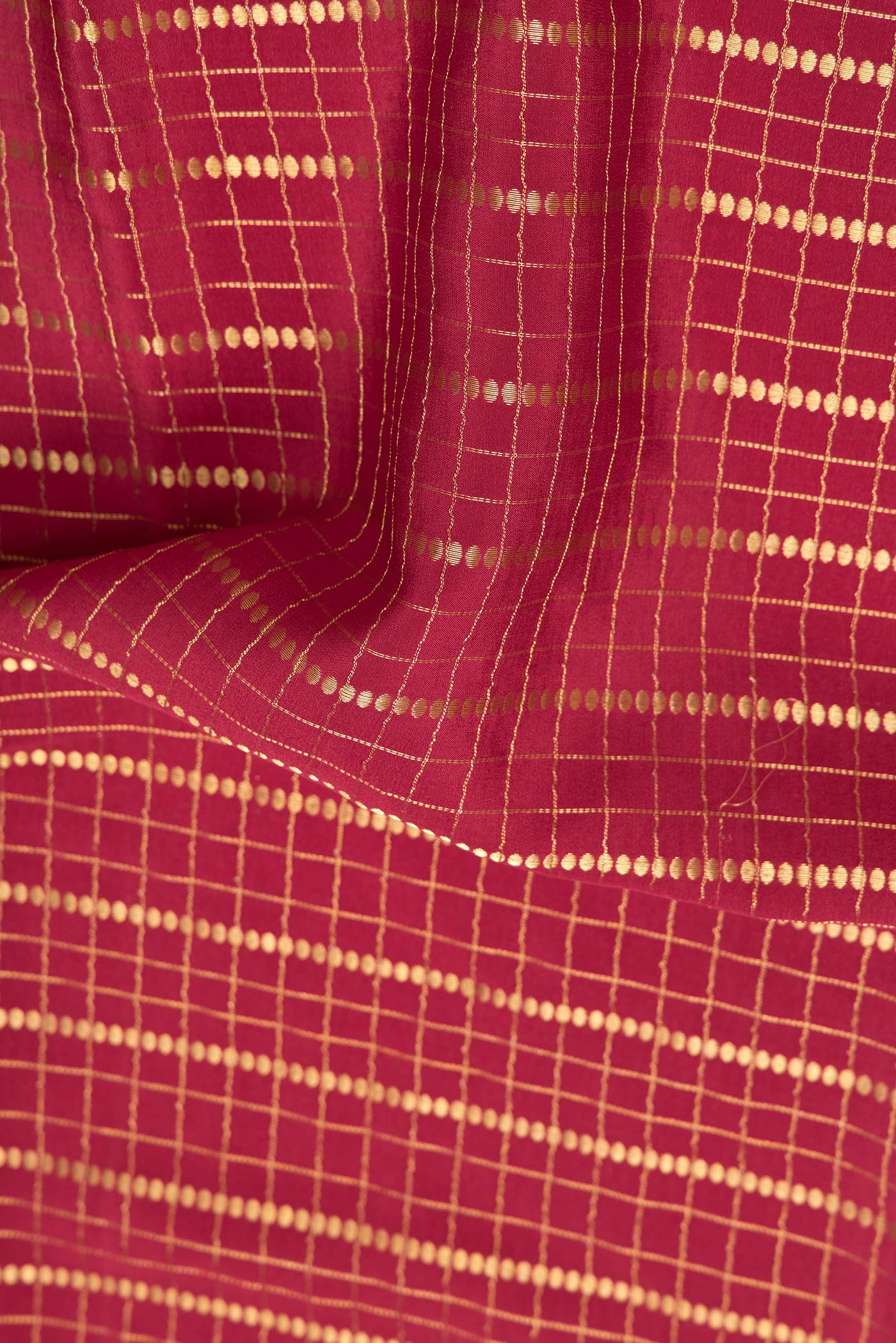 Close up of Maroon Dual Tone Mysore Silk Saree with Checked design on the body and Fancy Border.  displaying folds