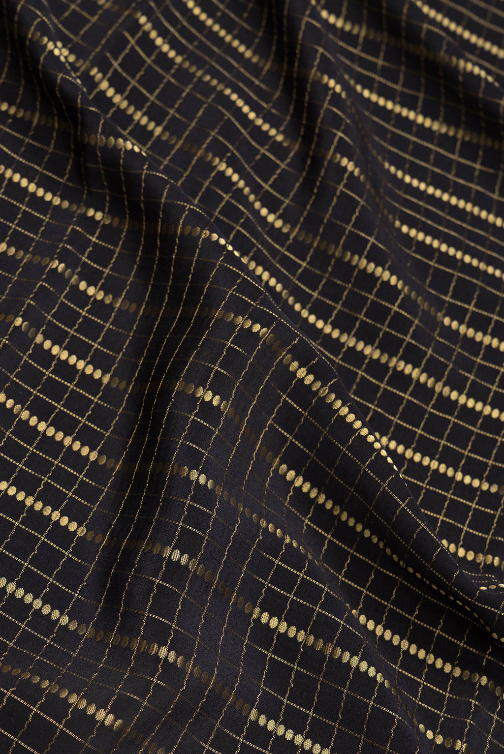Close up of Black Dual Tone Mysore Silk Saree with Checked design on the body and Zari Border.  displaying folds