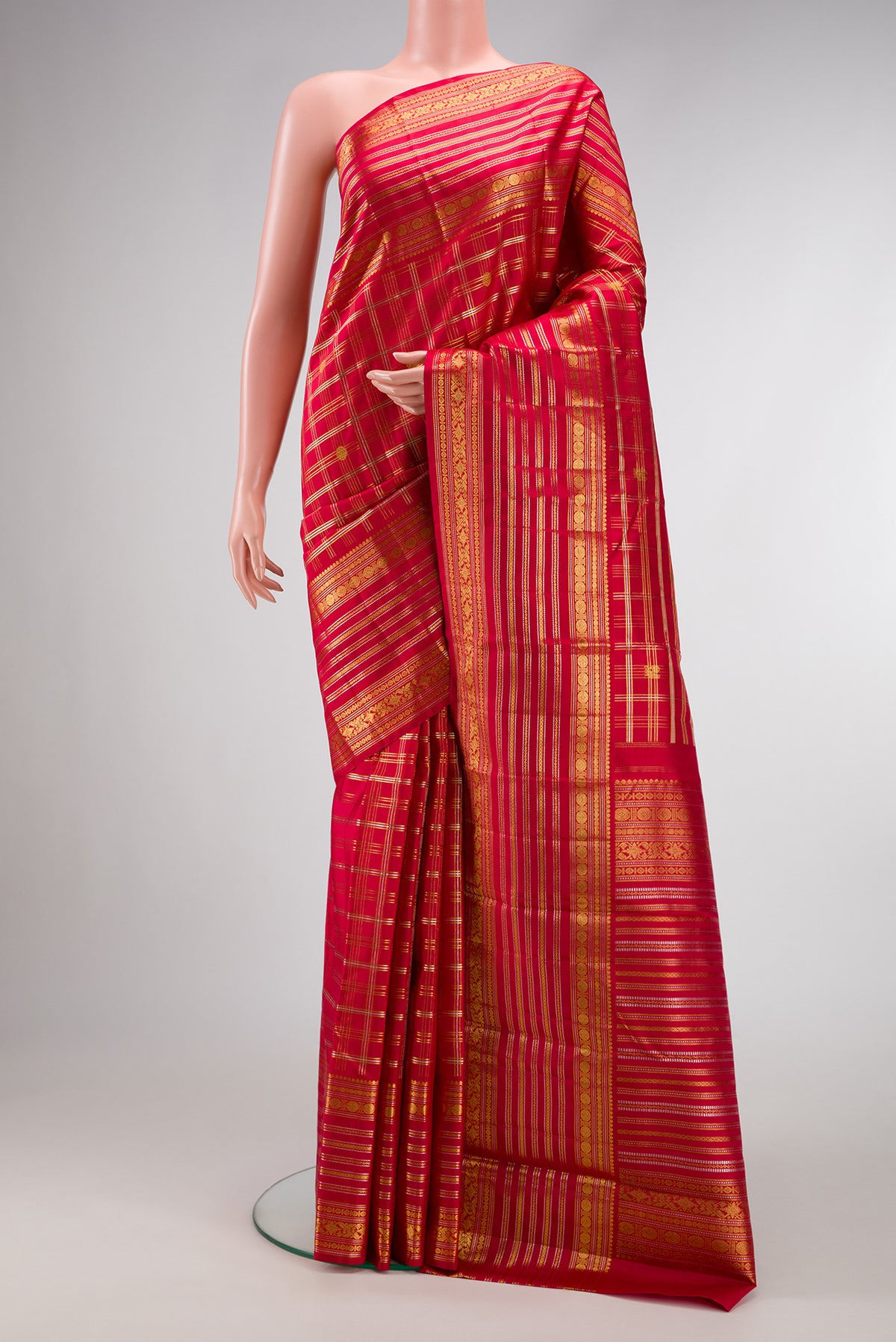 Red Dual Tone Kanjivaram Silk Saree with Checked design on the body and Zari Border.  displayed on a mannequin