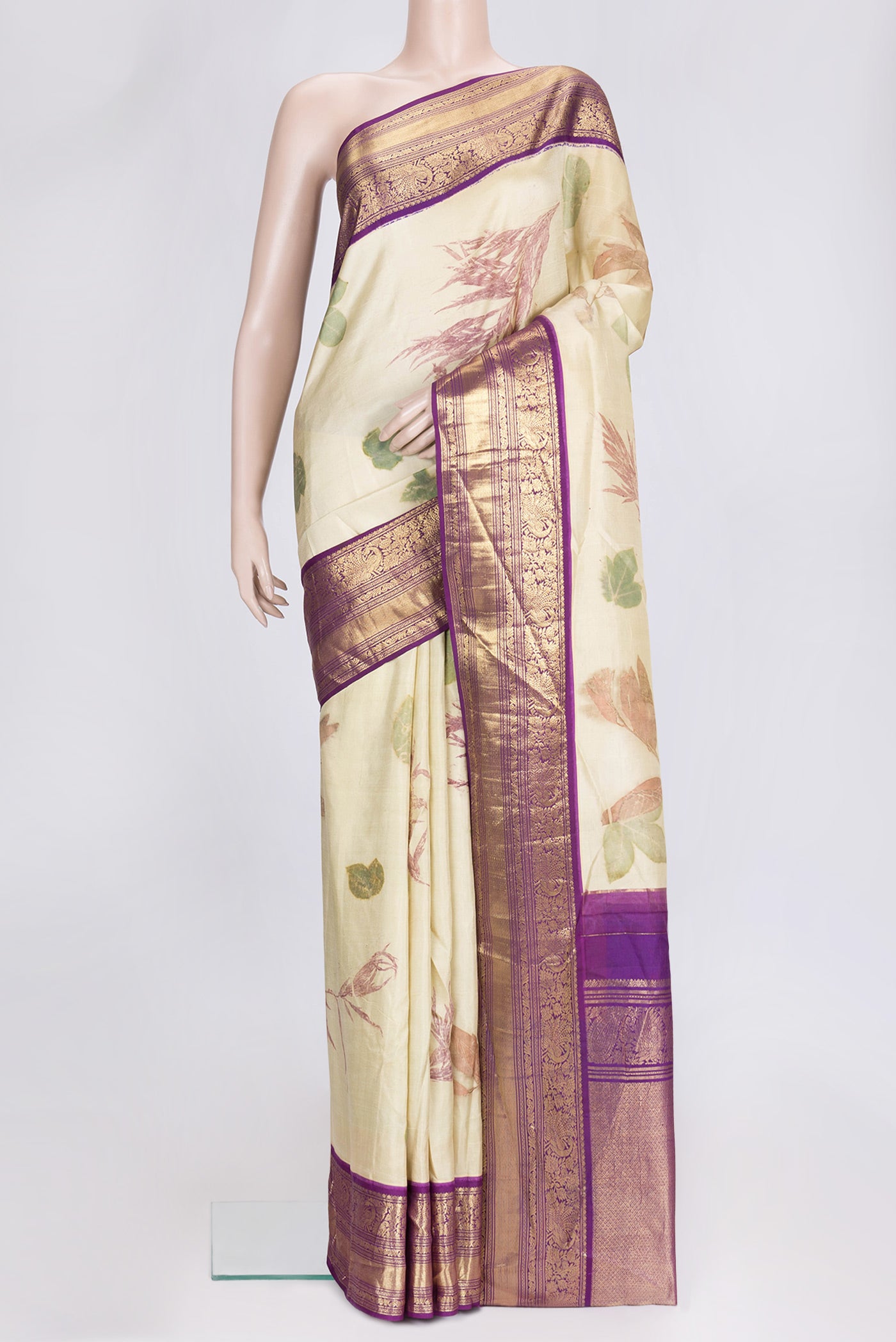 Beige Dual Tone Kanchipuram Silk Saree with Printed design on the body and Zari Border.  displayed on a mannequin