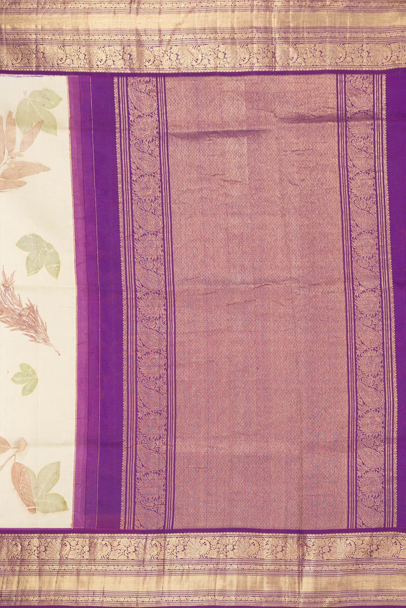 Close up image of the pallu of Beige Dual Tone Kanchipuram Silk Saree with Printed design on the body and Zari Border. 
