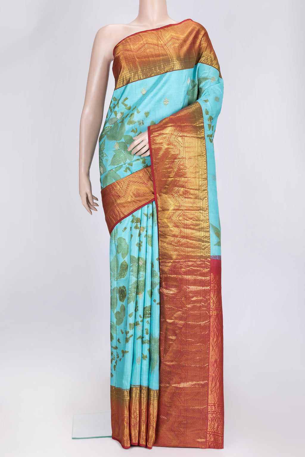 Sky Blue Dual Tone Kanchipuram Silk Saree with Printed design on the body and Zari Border.  displayed on a mannequin