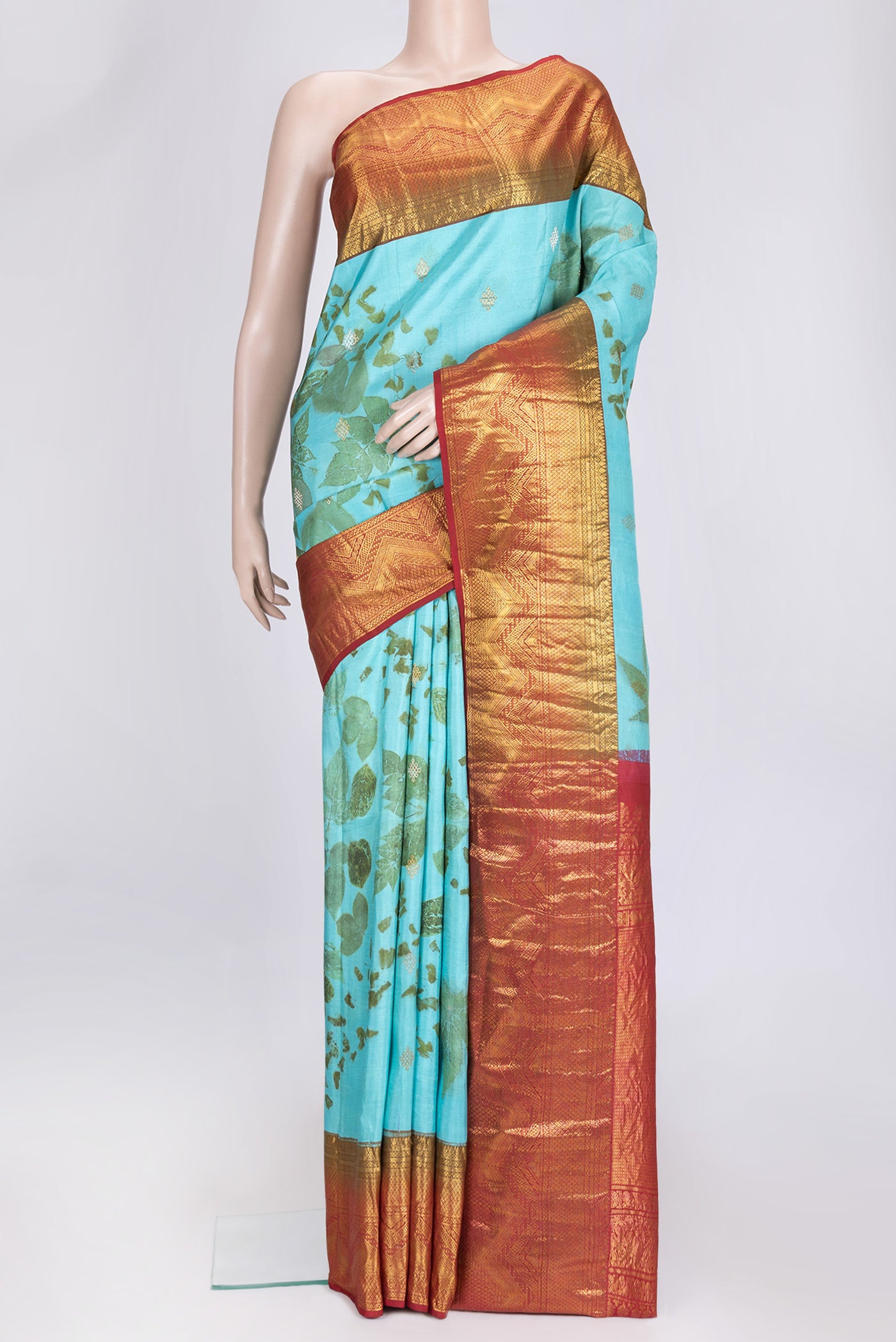 Sky Blue Dual Tone Kanchipuram Silk Saree with Printed design on the body and Zari Border.  displayed on a mannequin
