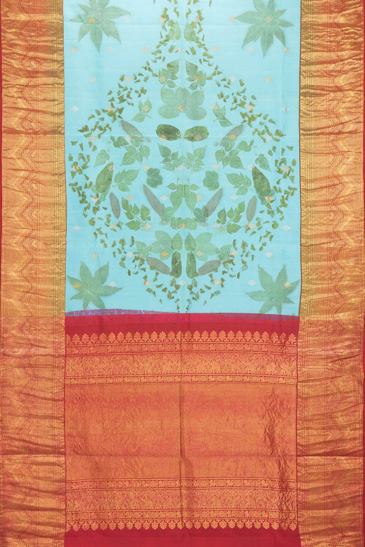 Flat view of Sky Blue Dual Tone Kanchipuram Silk Saree with Printed design on the body and Zari Border. 
