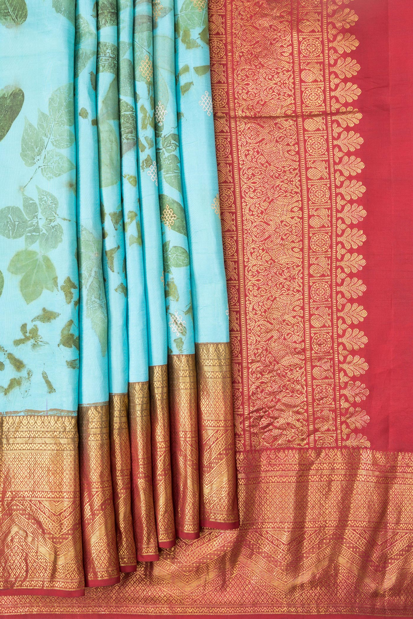 Pleats and pallu of Sky Blue Dual Tone Kanchipuram Silk Saree with Printed design on the body and Zari Border. 