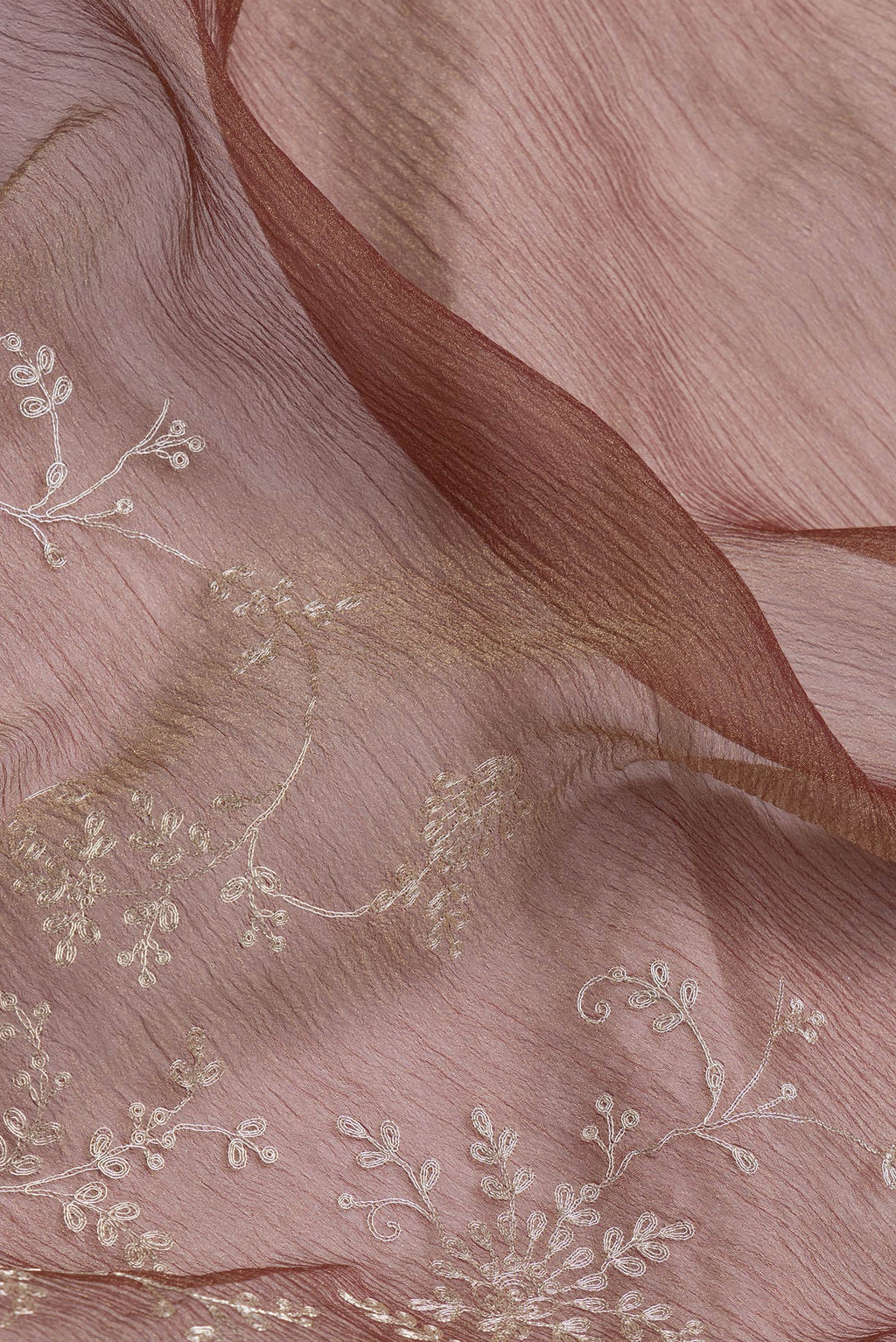 Close up of Brown Dual Tone Organza Silk Saree with Embroidery on the body and Embroidery Border.  displaying folds