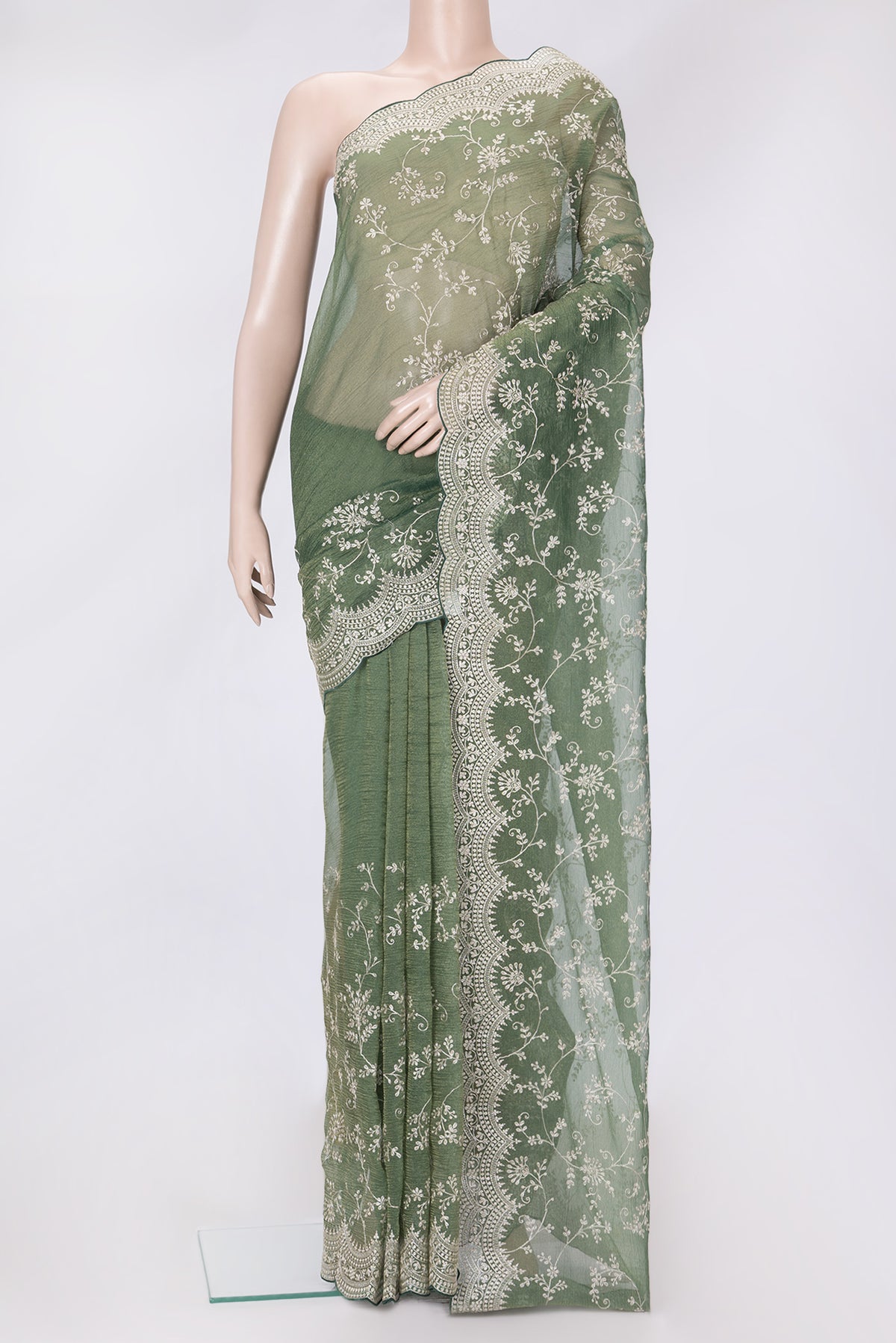 Green Dual Tone Organza Silk Saree with Embroidery on the body and Embroidery Border.  displayed on a mannequin