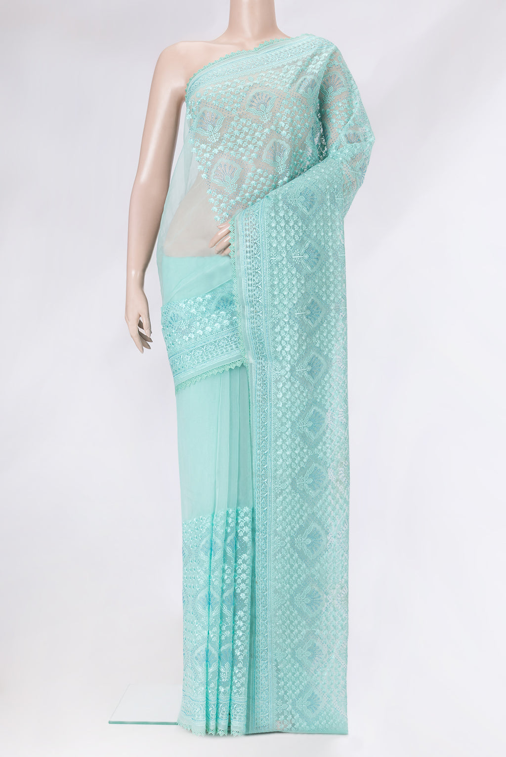 Sea Green Dual Tone Organza Silk Saree with Embroidery on the body and Embroidery Border.  displayed on a mannequin