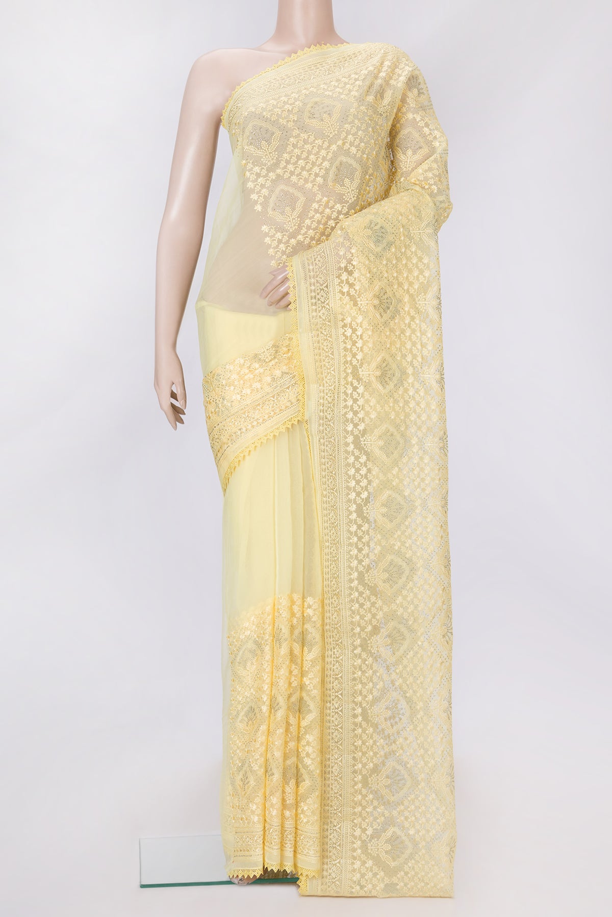 Yellow Dual Tone Organza Silk Saree with Embroidery on the body and Embroidery Border.  displayed on a mannequin