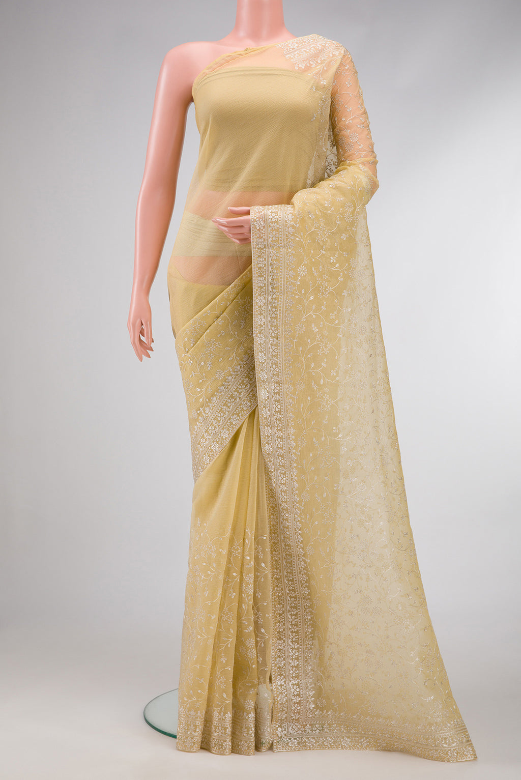 Sandal Dual Tone Organza Silk Saree with Embroidery on the body and Embroidery Border.  displayed on a mannequin