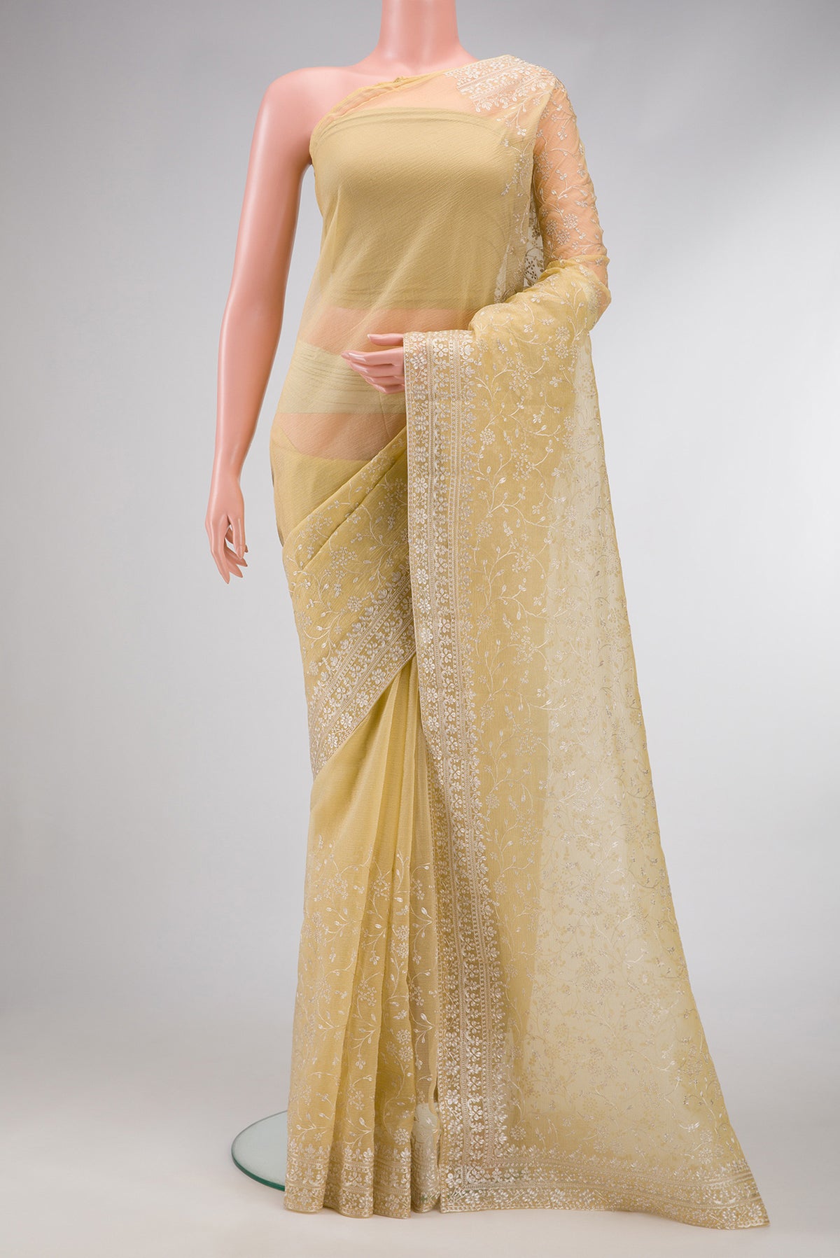 Sandal Dual Tone Organza Silk Saree with Embroidery on the body and Embroidery Border.  displayed on a mannequin