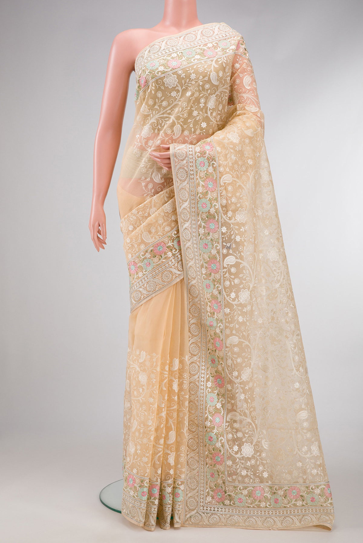 Sandal Dual Tone Organza Silk Saree with Embroidery on the body and Embroidery Border.  displayed on a mannequin