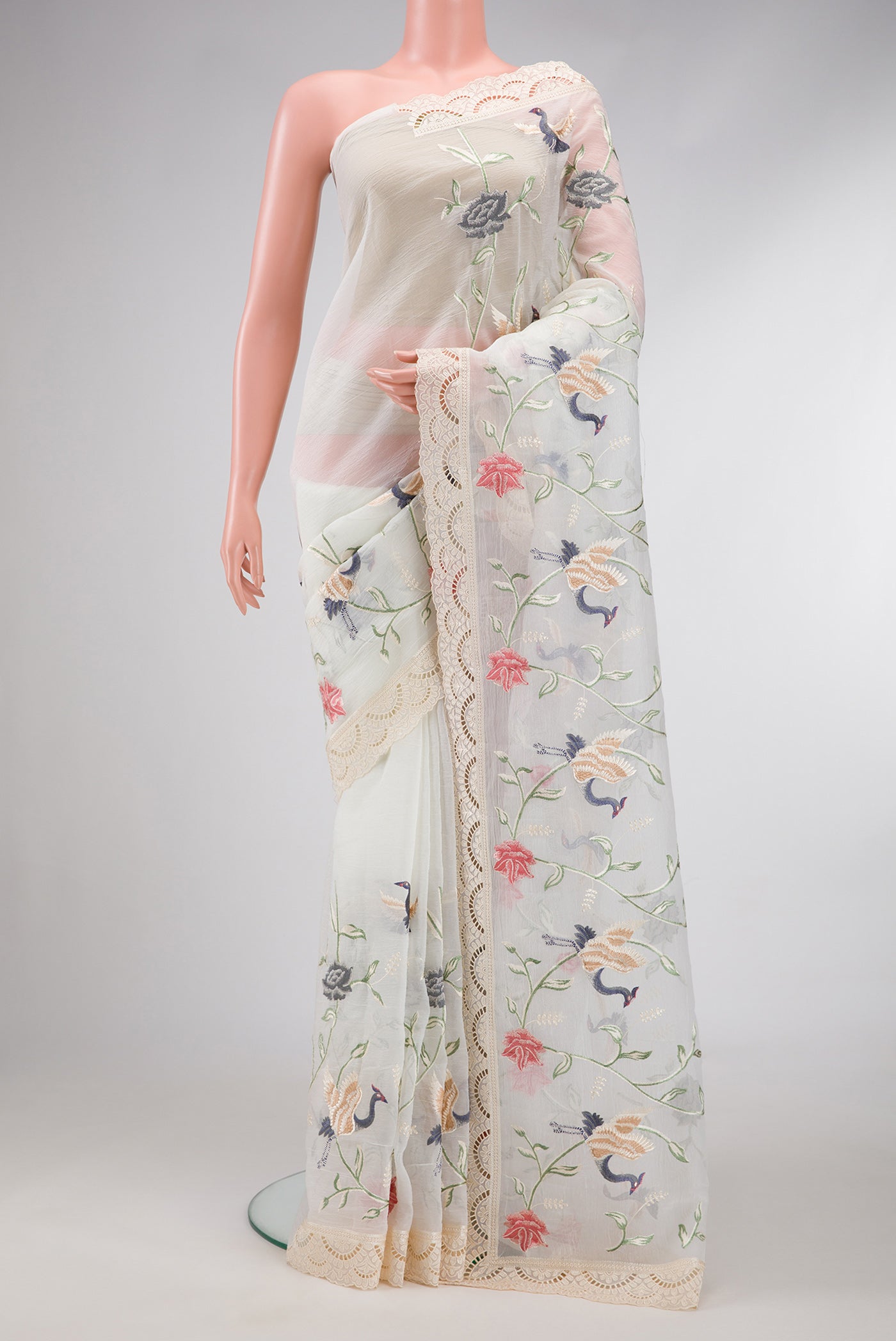 Off White Dual Tone Organza Silk Saree with Embroidery on the body and Embroidery Border.  displayed on a mannequin