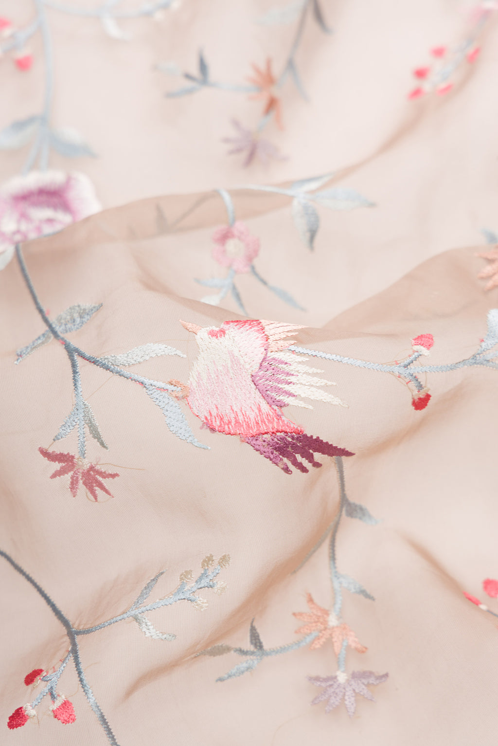 Close up of Brown Dual Tone Organza Silk Saree with Embroidery on the body and Embroidery Border.  displaying folds