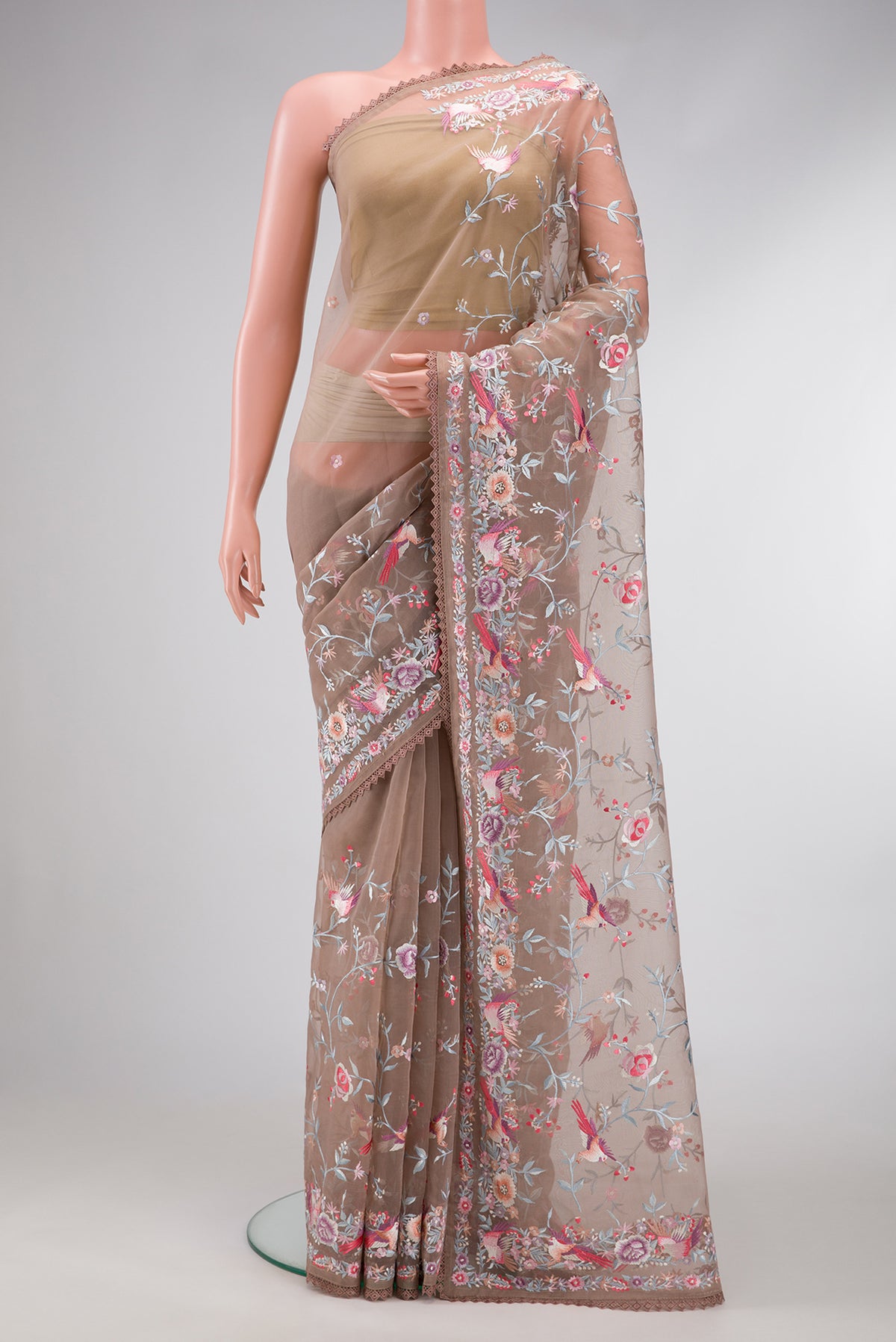 Brown Dual Tone Organza Silk Saree with Embroidery on the body and Embroidery Border.  displayed on a mannequin