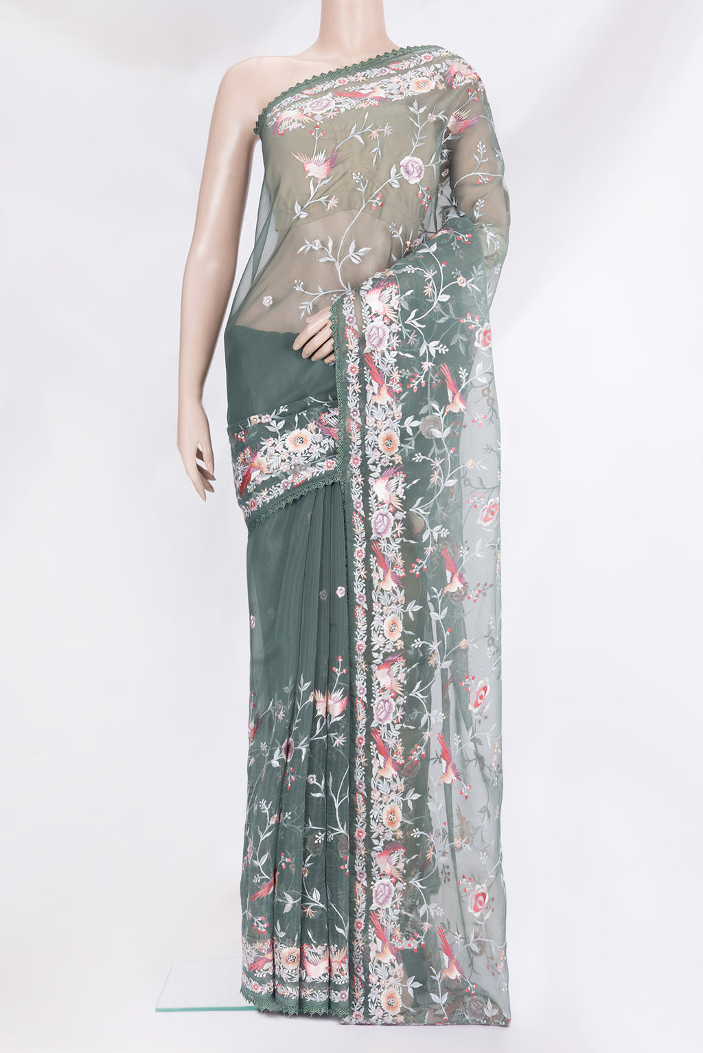 Green Blended Organza Silk Saree with Embroidery on the body and Embroidery Border.  displayed on a mannequin