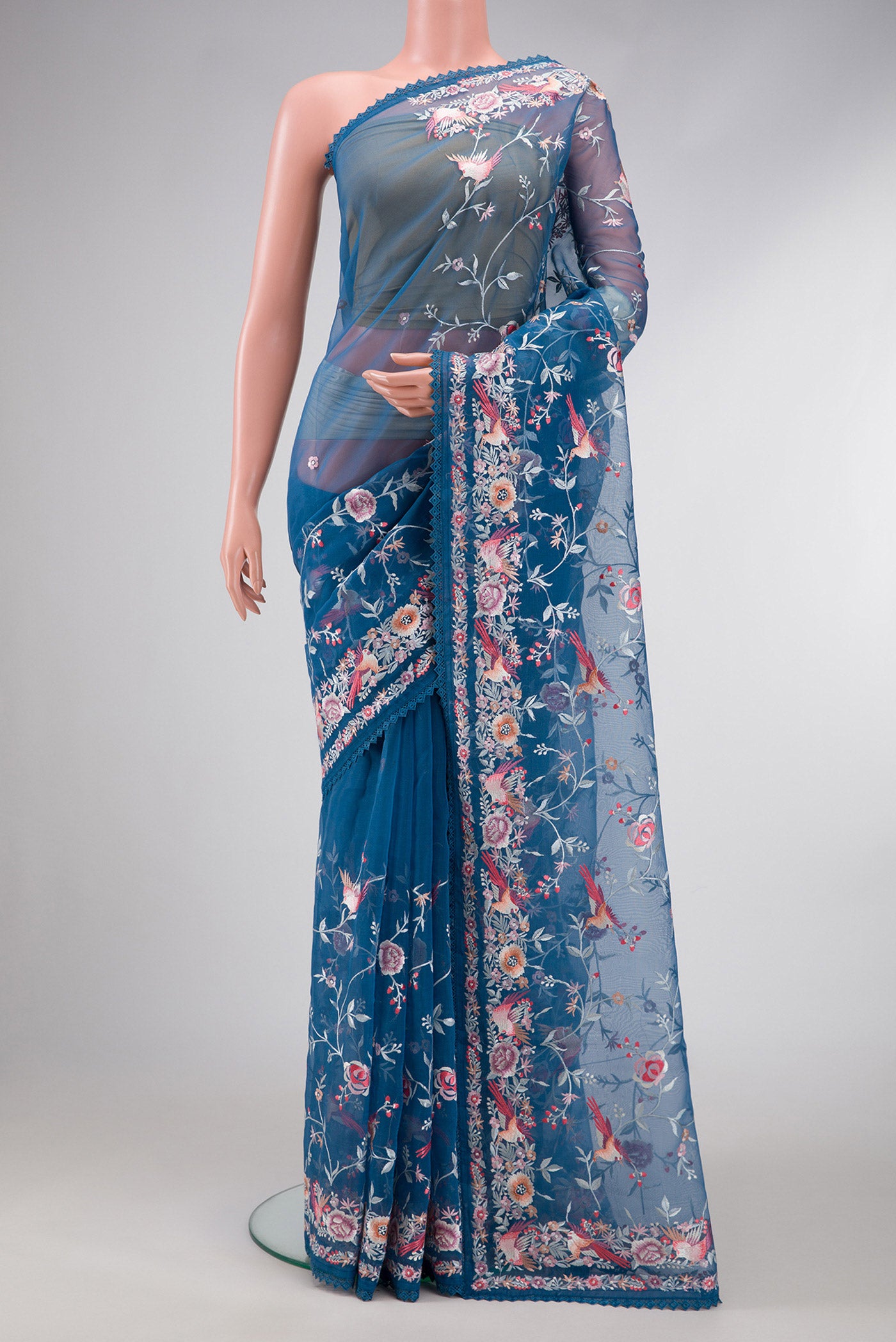 Maya Blue Dual Tone Organza Silk Saree with Embroidery on the body and Embroidery Border.  displayed on a mannequin