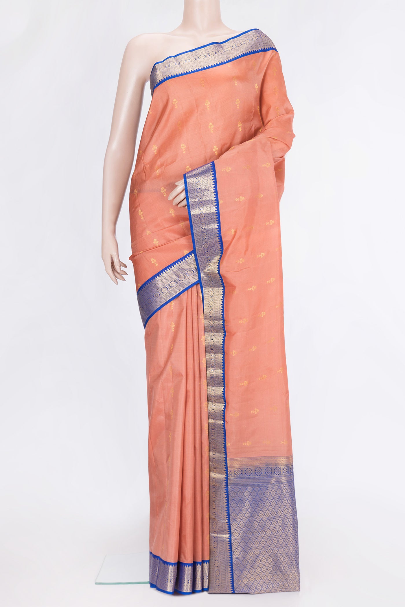 Rose Gold Dual Tone Kanchipuram Silk Saree with Zari Butta on the body and Zari Border.  displayed on a mannequin