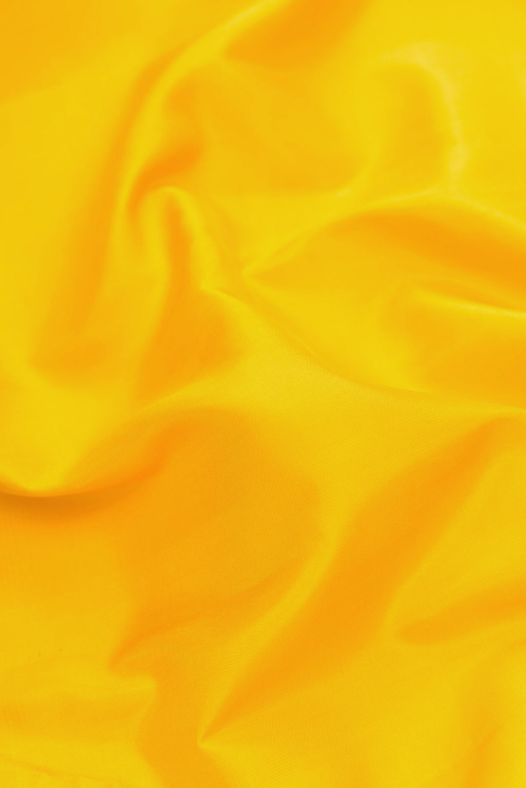 Close up of Yellow Dual Tone Kanjivaram Silk Saree with Plain Body and Temple Border.  displaying folds