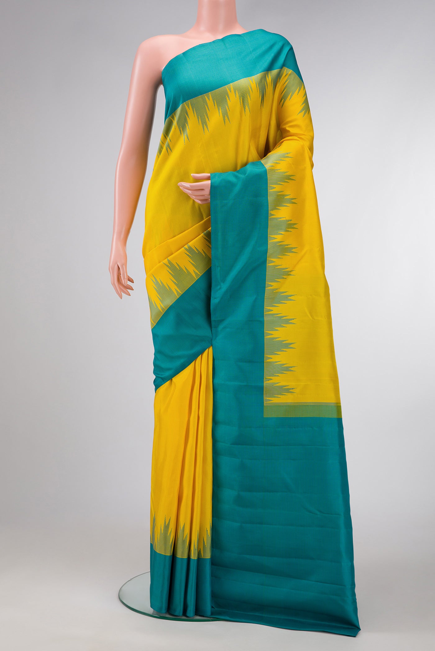 Yellow Dual Tone Kanjivaram Silk Saree with Plain Body and Temple Border.  displayed on a mannequin