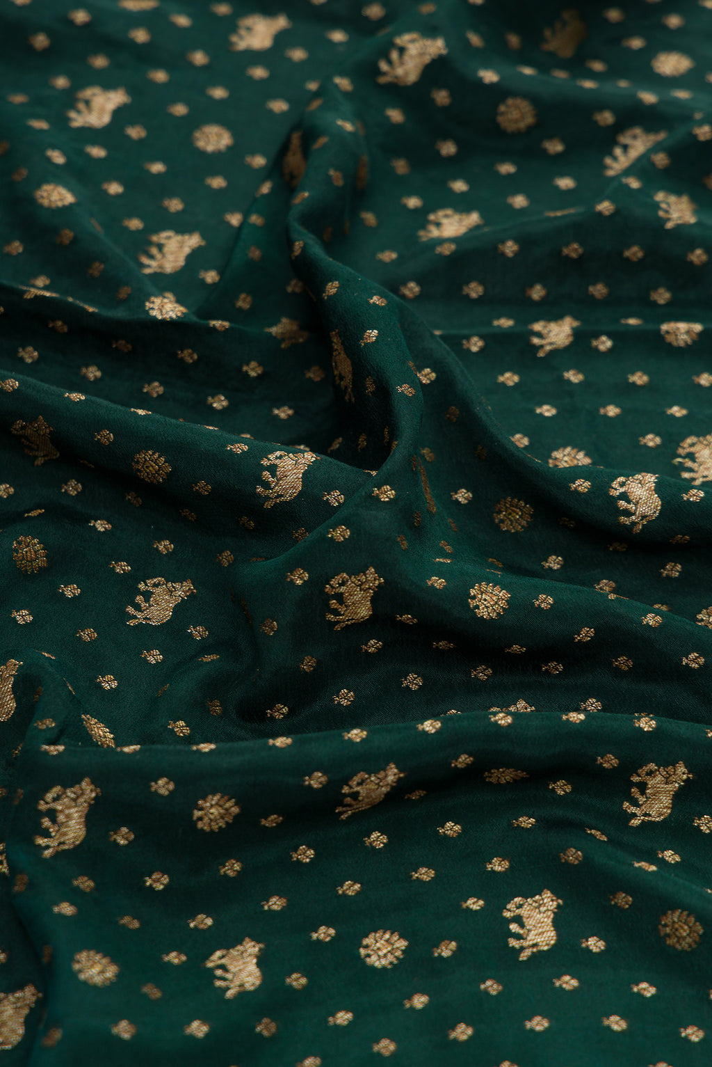 Close up of Bottle Green Dual Tone Mysore Georgette Saree with Zari Butta on the body and Zari Border.  displaying folds