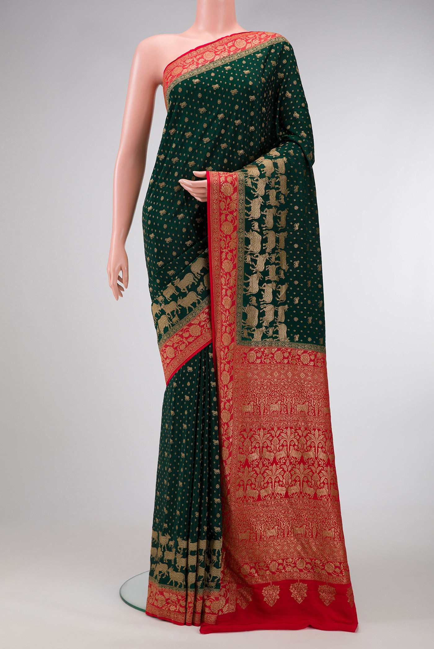 Bottle Green Dual Tone Mysore Georgette Saree with Zari Butta on the body and Zari Border.  displayed on a mannequin
