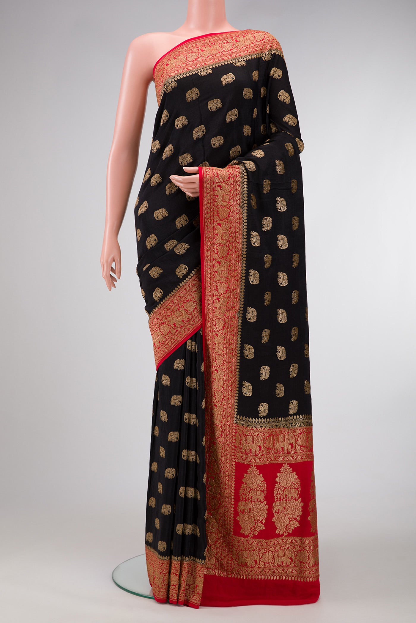 Black Dual Tone Georgette Saree with Zari Butta on the body and Zari Border.  displayed on a mannequin