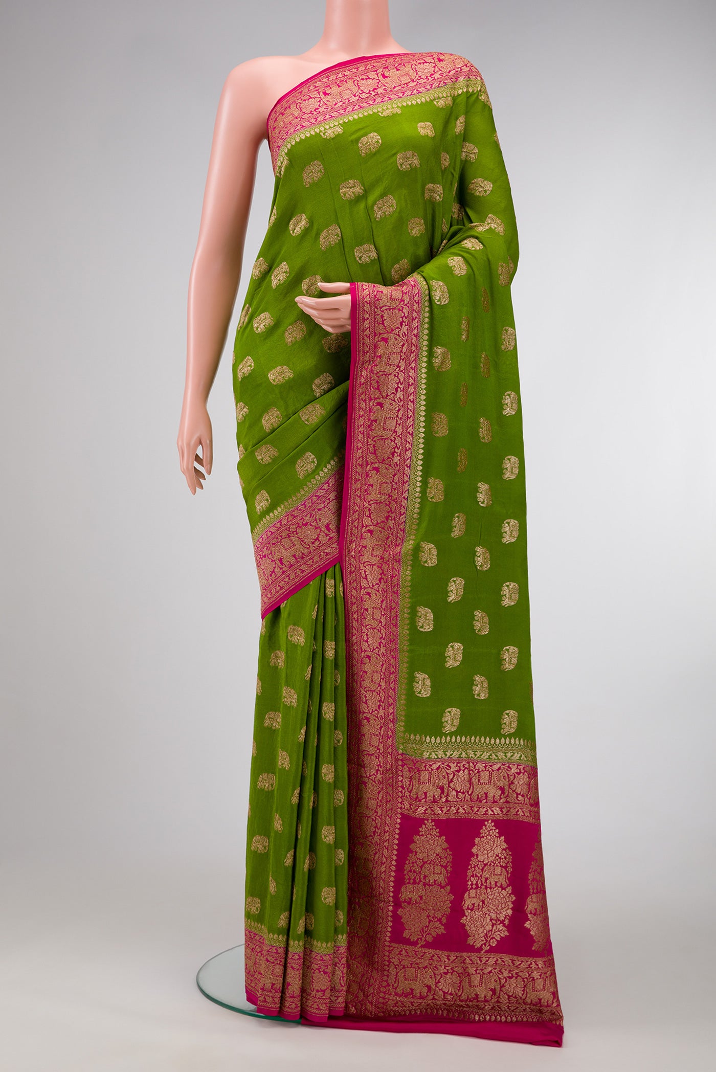 Green Dual Tone Mysore Georgette Saree with Zari Butta on the body and Zari Border.  displayed on a mannequin