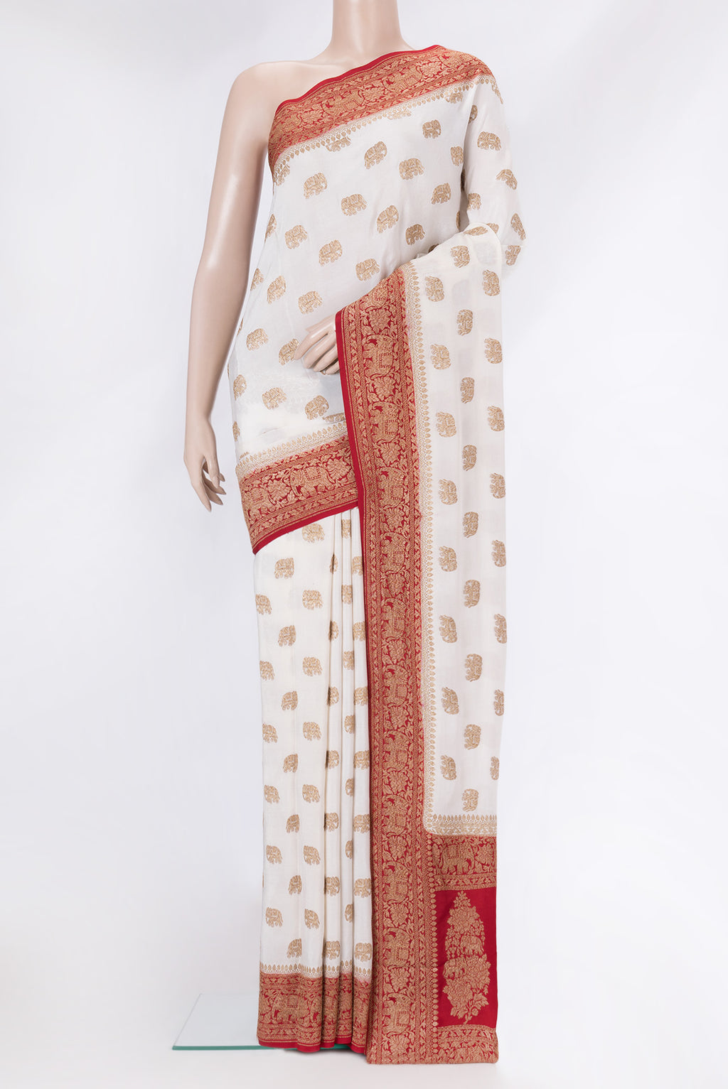 Off White Banarasi Georgette Saree with Zari Butta on the body and Zari Border.  displayed on a mannequin