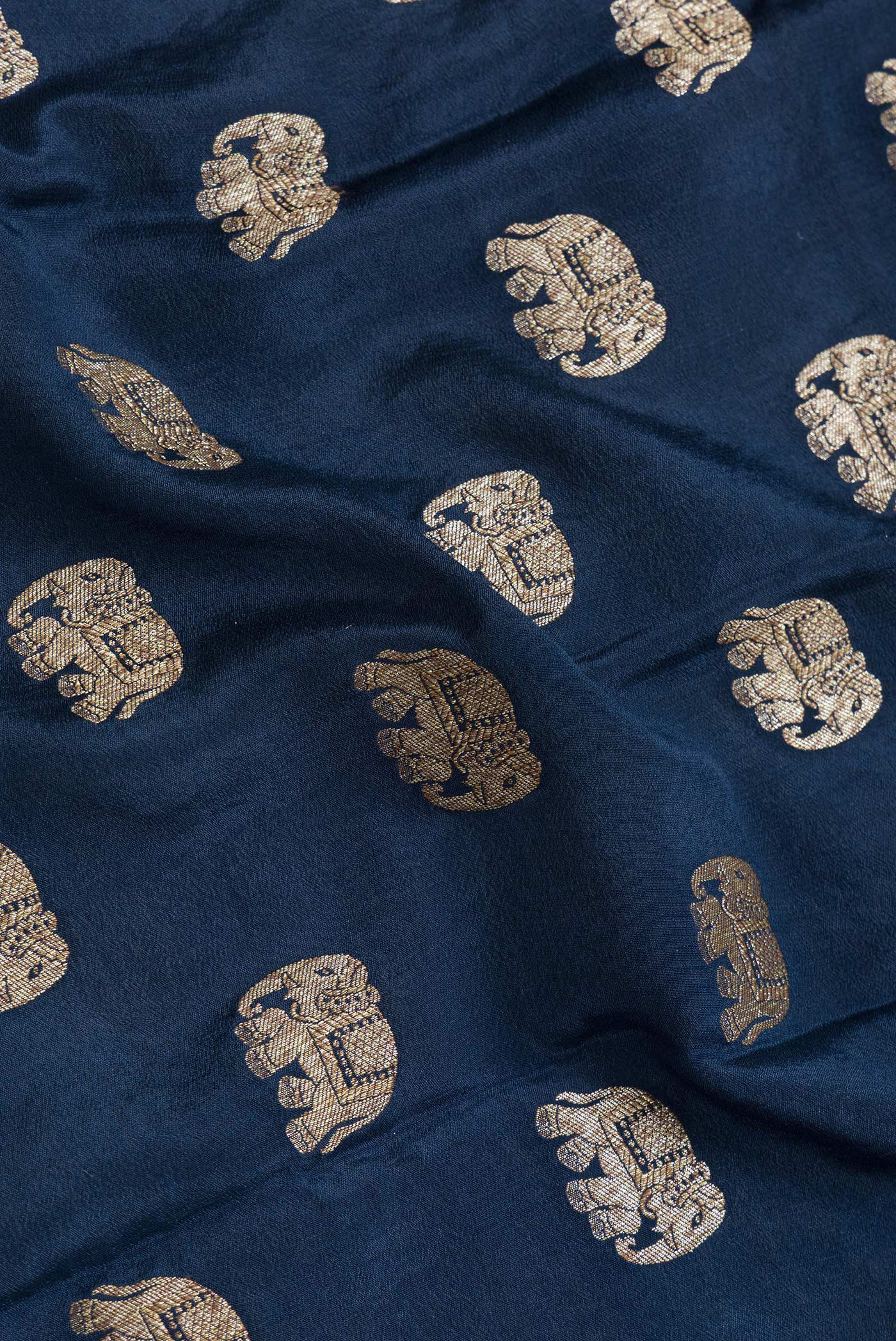 Close up of Navy Blue Dual Tone Banarasi Georgette Saree with Zari Butta on the body and Fancy Border.  displaying folds
