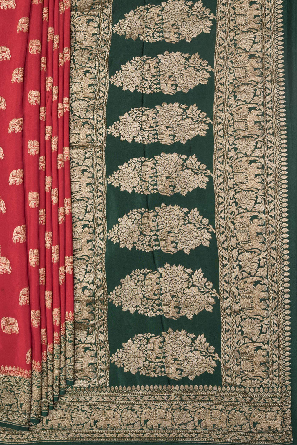Pleats and pallu of Deep Red Dual Tone Banarasi Georgette Saree with Zari Butta on the body and Zari Border. 