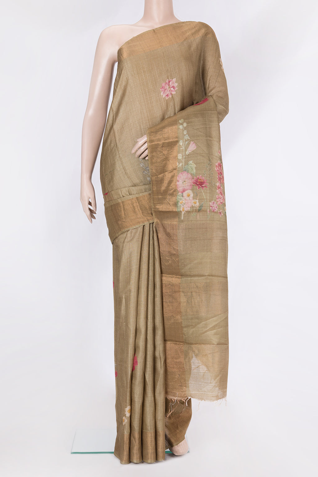 Dark Beige Tussar Silk Saree with Printed design on the body and Zari Border.  displayed on a mannequin