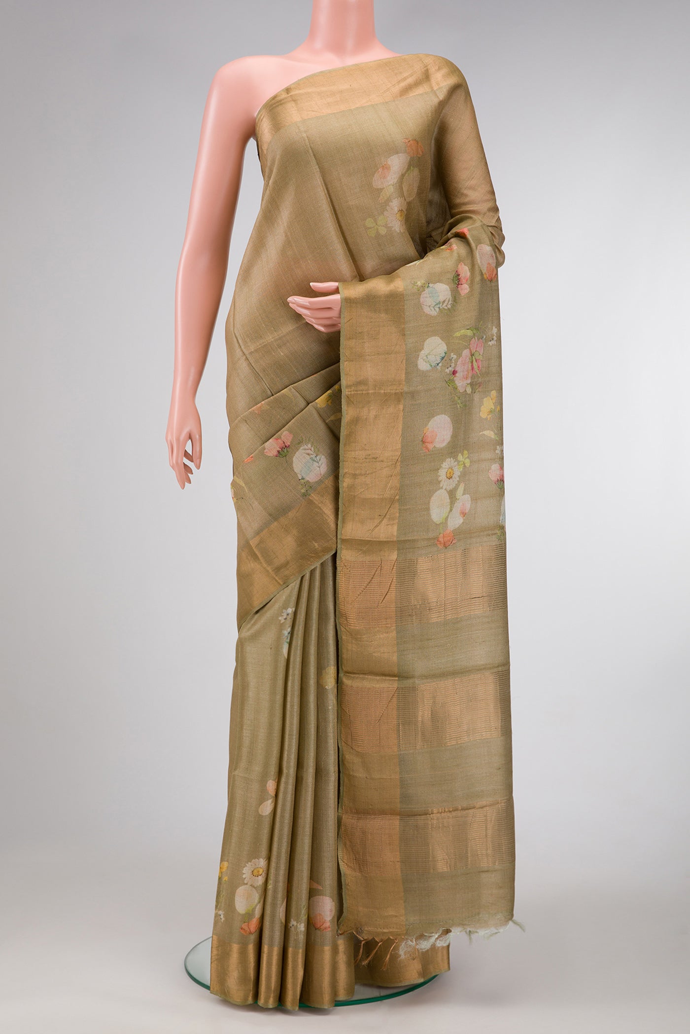 Light Green Dual Tone Tussar Silk Saree with Printed design on the body and Zari Border.  displayed on a mannequin