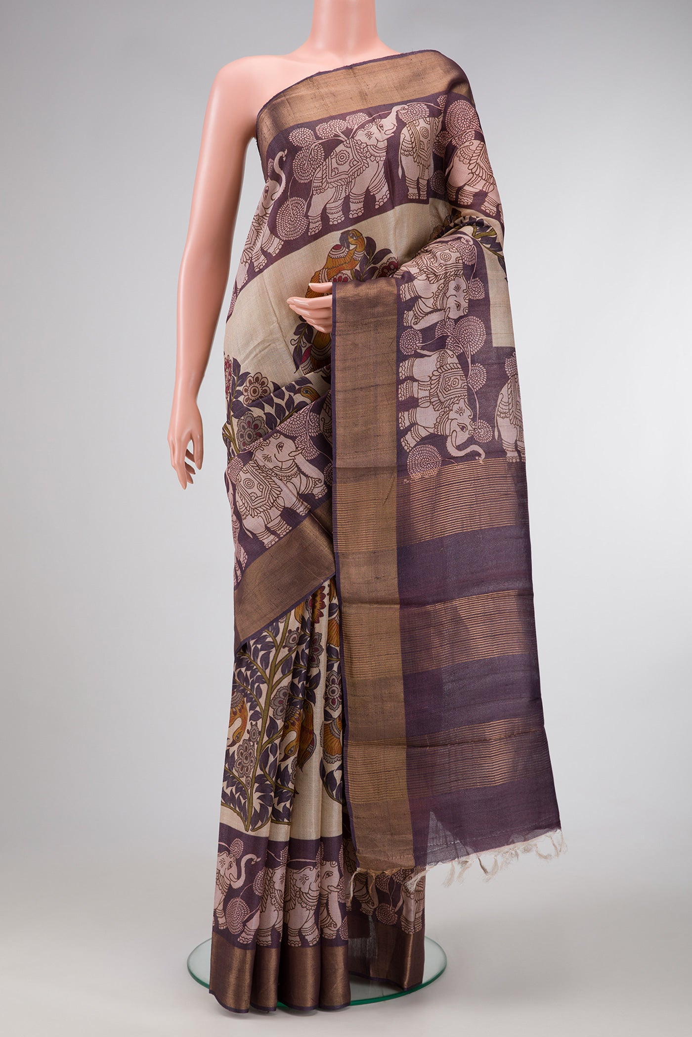 Purple Dual Tone Tussar Silk Saree with Printed design on the body and Zari Border.  displayed on a mannequin