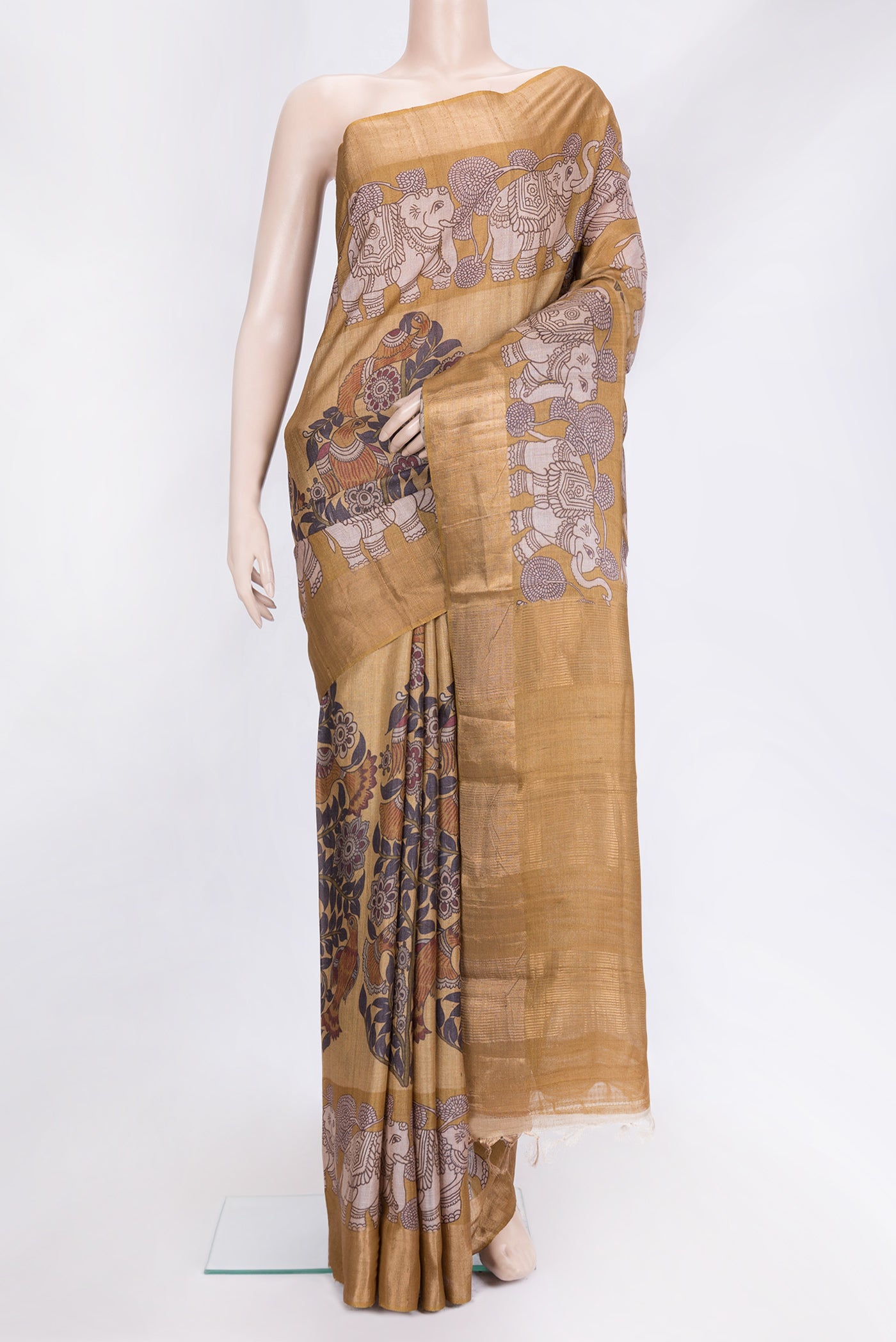 Mustard Dual Tone Tussar Silk Saree with Printed design on the body and Fancy Border.  displayed on a mannequin