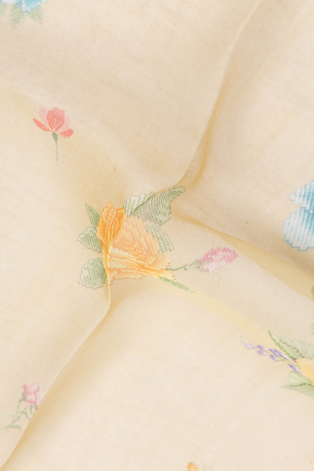 Close up of Sandal Organza Silk Saree with Printed design on the body and Zari Border.  displaying folds