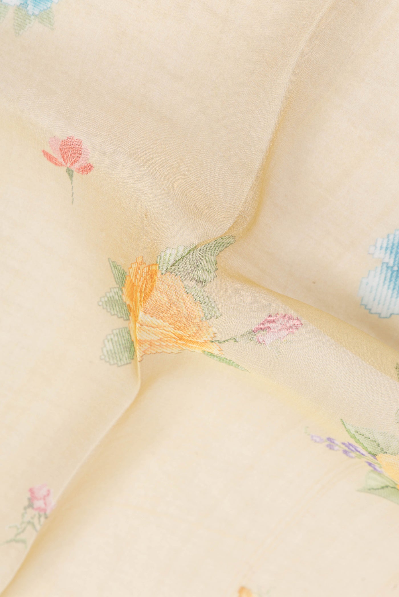 Close up of Sandal Organza Silk Saree with Printed design on the body and Zari Border.  displaying folds