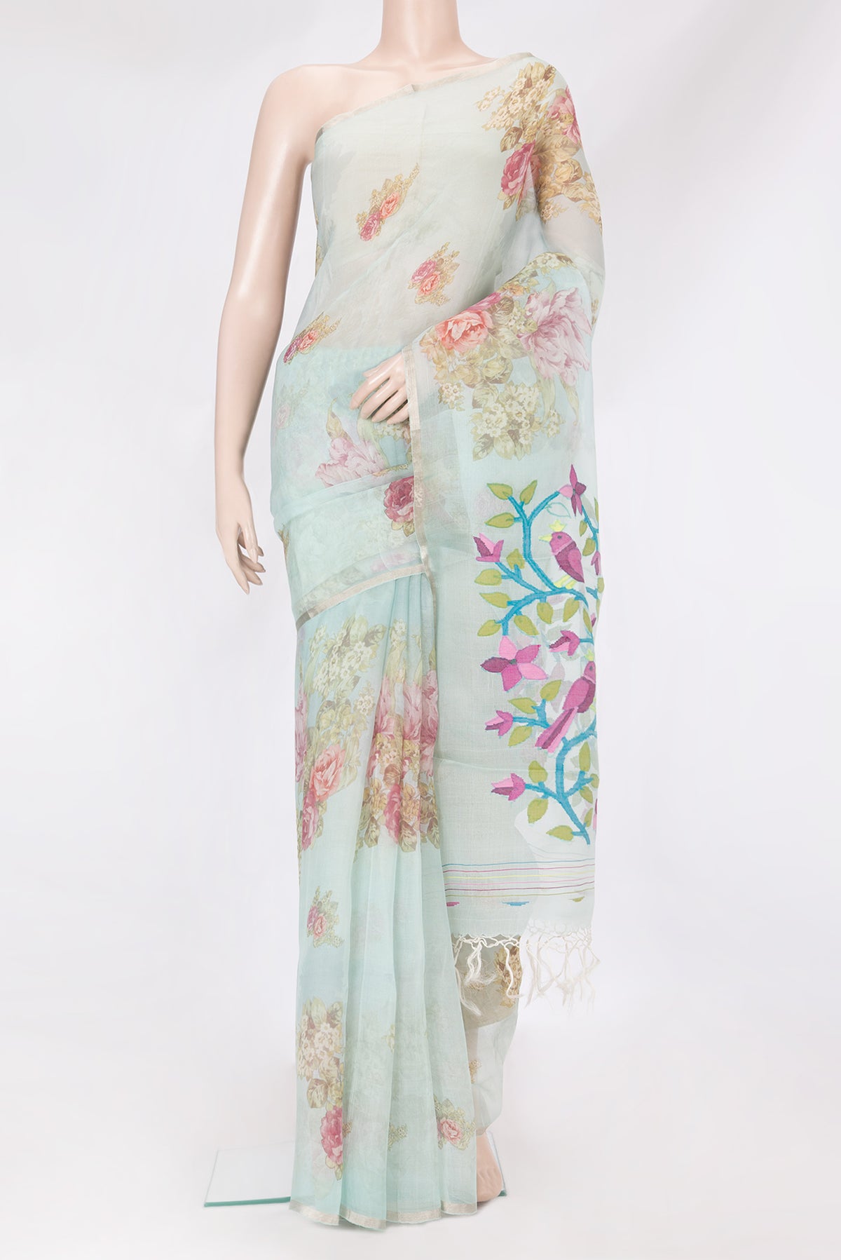 Sky Blue Organza Silk Saree with Floral Print on the body and Thin Zari Line.  displayed on a mannequin