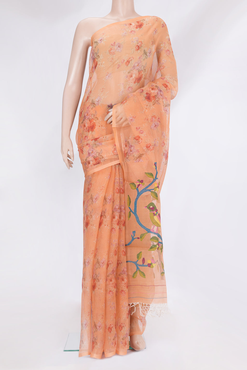 Peach Organza Silk Saree with Printed design on the body and Without Border.  displayed on a mannequin