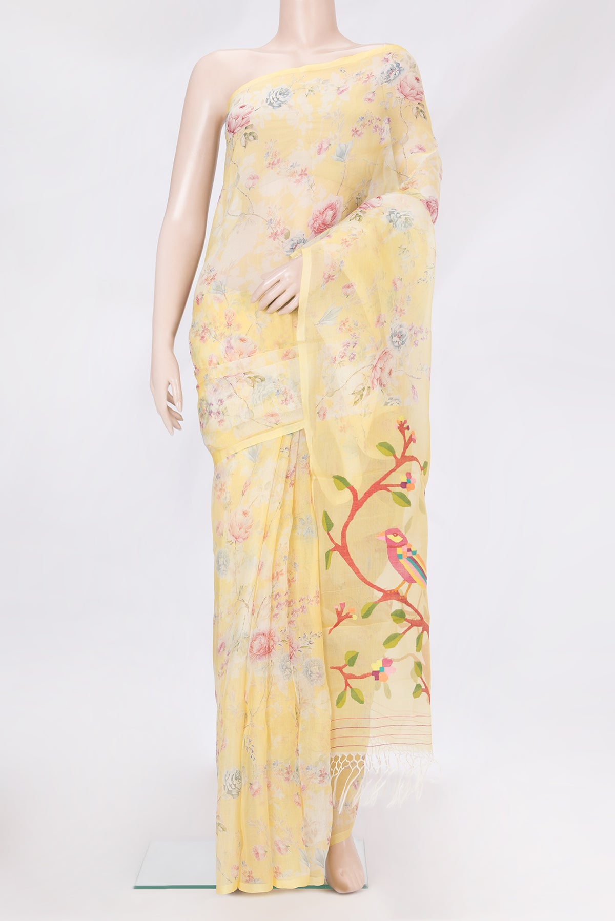 Lemon Yellow Organza Silk Saree with Printed design on the body and Without Border.  displayed on a mannequin