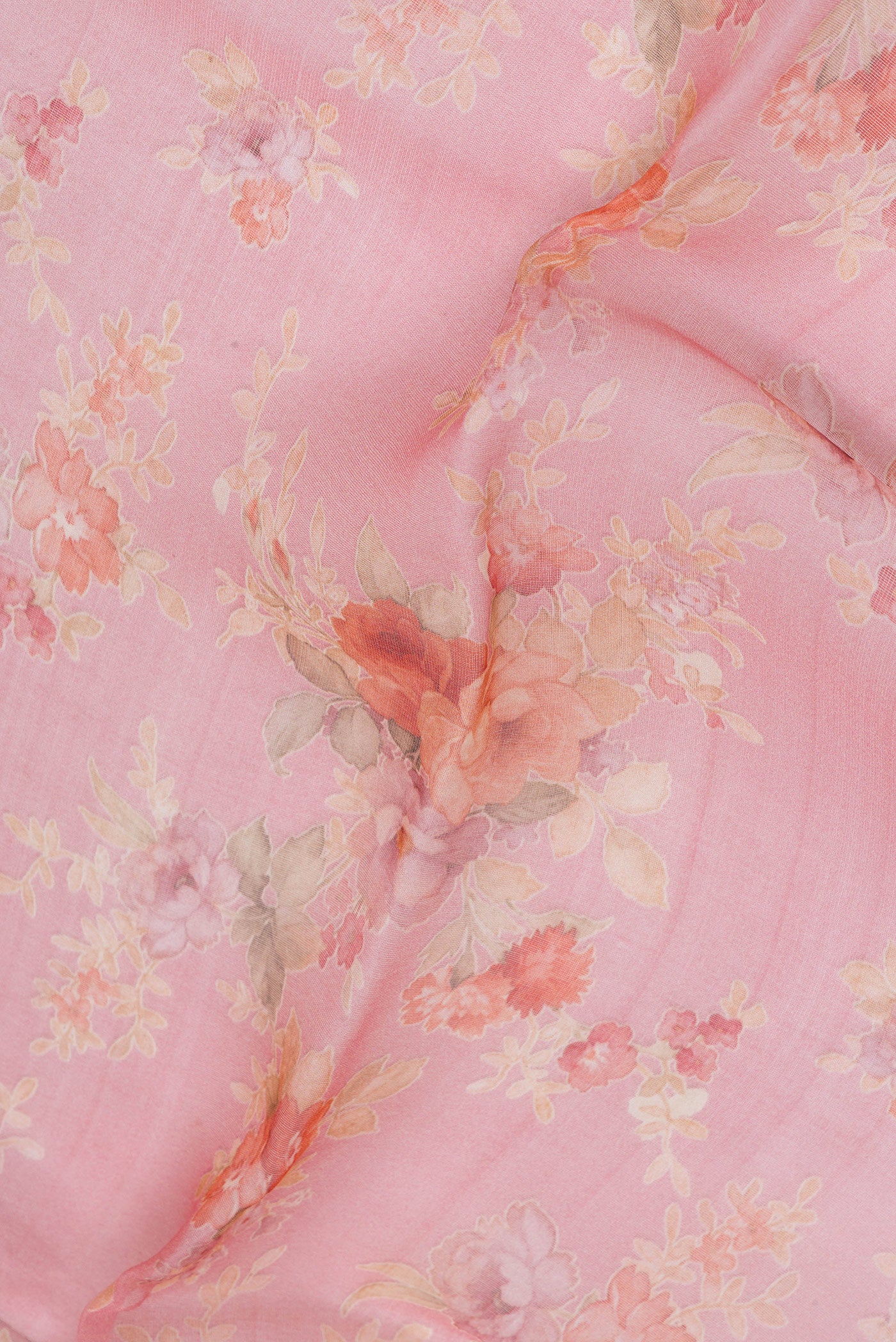 Close up of Pink Organza Silk Saree with Floral Print on the body and Without Border.  displaying folds