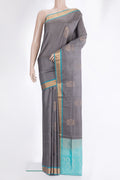 Pure Silk Grey Dual Tone Soft Saree with Zari Butta on the body and Zari Border.  displayed on a mannequin