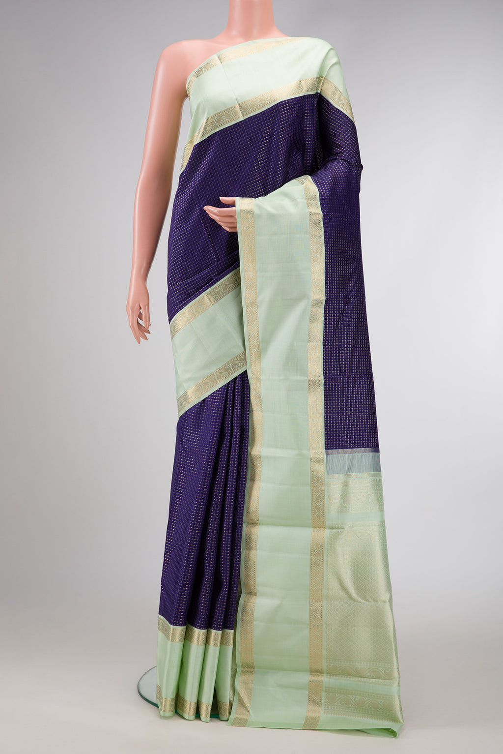 Navy Blue Dual Tone Kanjivaram Silk Saree with Checked design on the body and Zari Border.  displayed on a mannequin