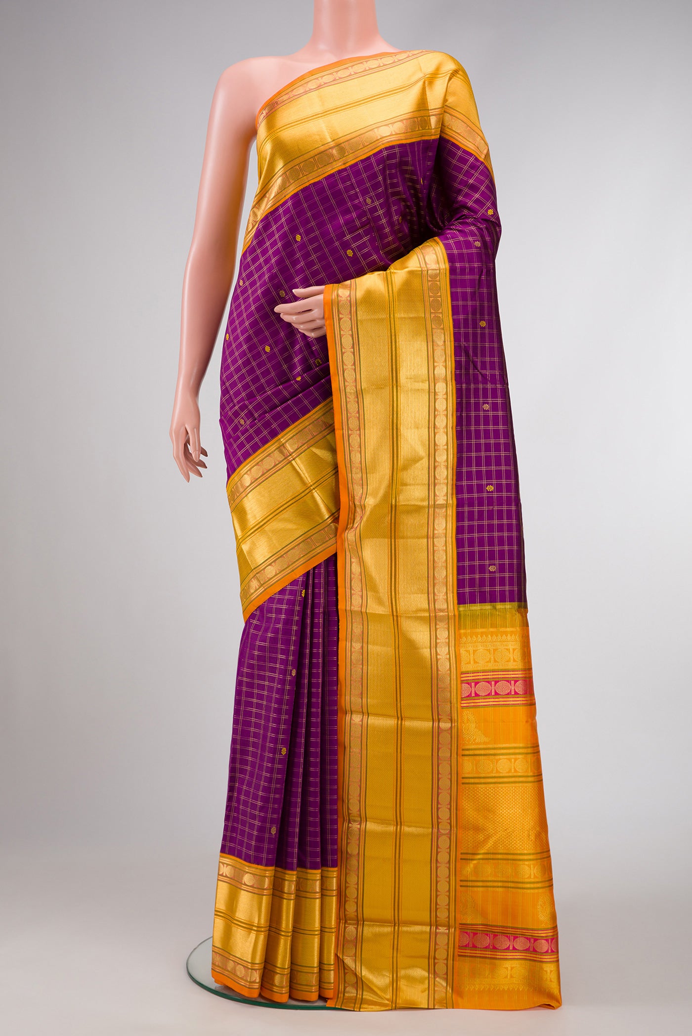 Purple Dual Tone Kanjivaram Silk Saree with Zari And Thread Butta on the body and Zari Border.  displayed on a mannequin
