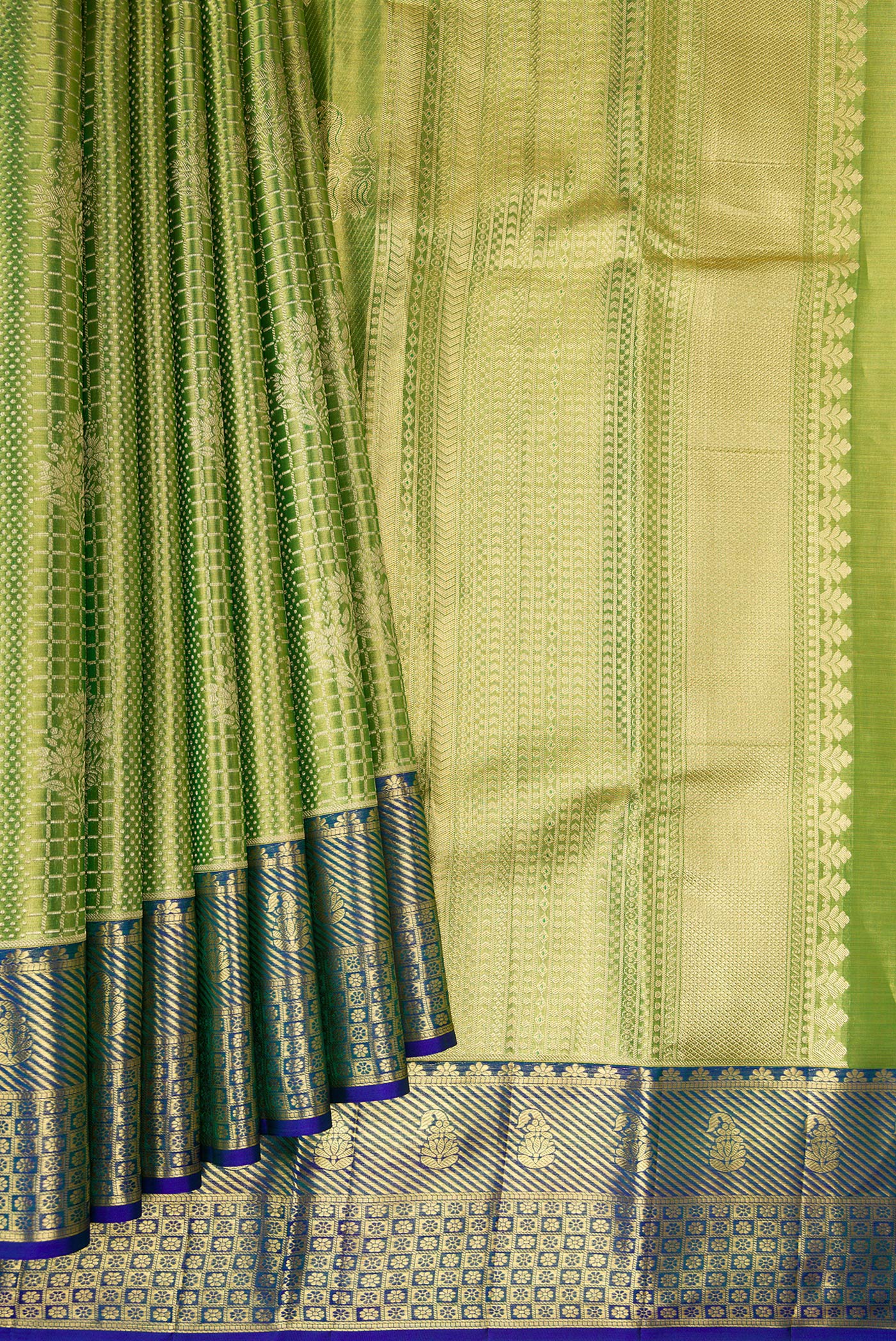 Pleats and pallu of Parrot Green Dual Tone Kanchipuram Tissue Silk Saree with Zari Brocade on the body and Zari Border. 