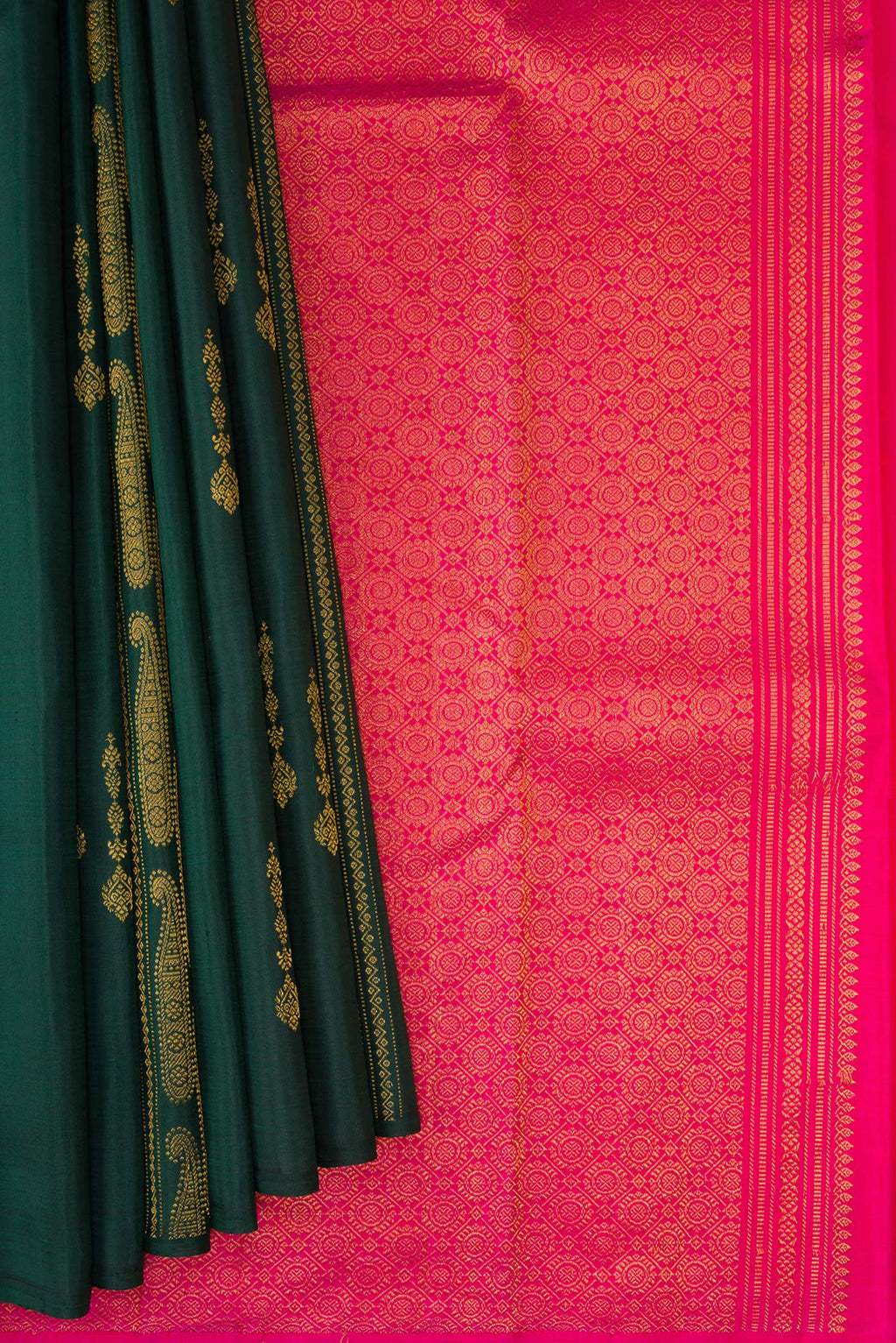 Pleats and pallu of Bottle Green Kanchipuram Silk Saree with Zari Butta on the body and Without Border. 