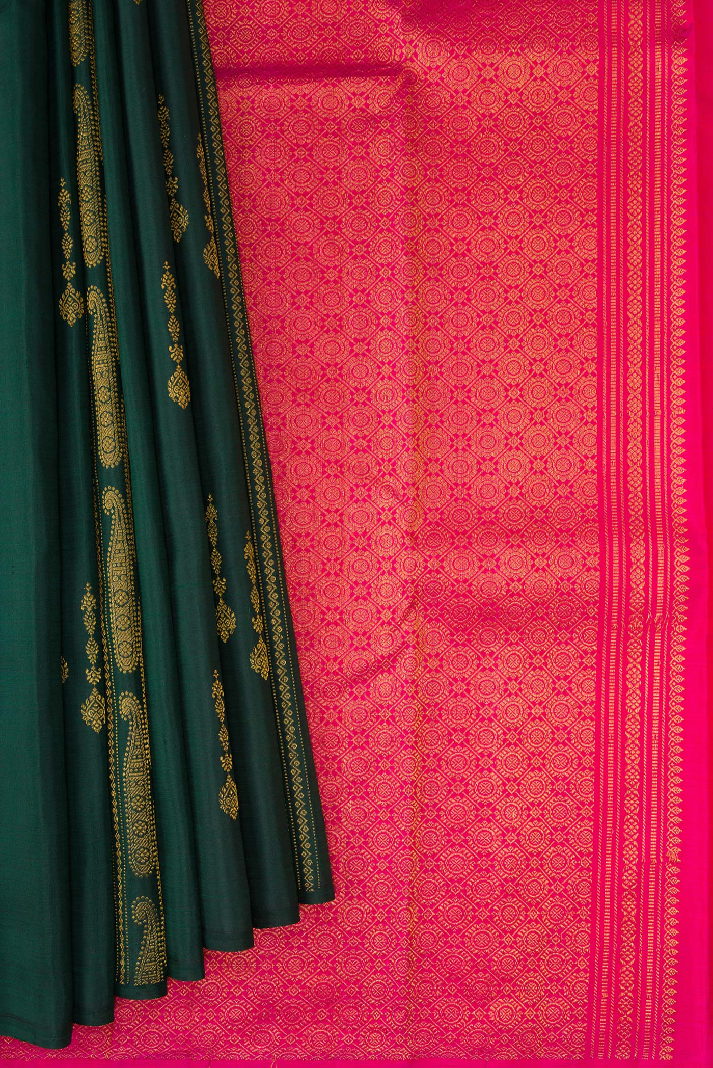 Pleats and pallu of Bottle Green Kanchipuram Silk Saree with Zari Butta on the body and Without Border. 