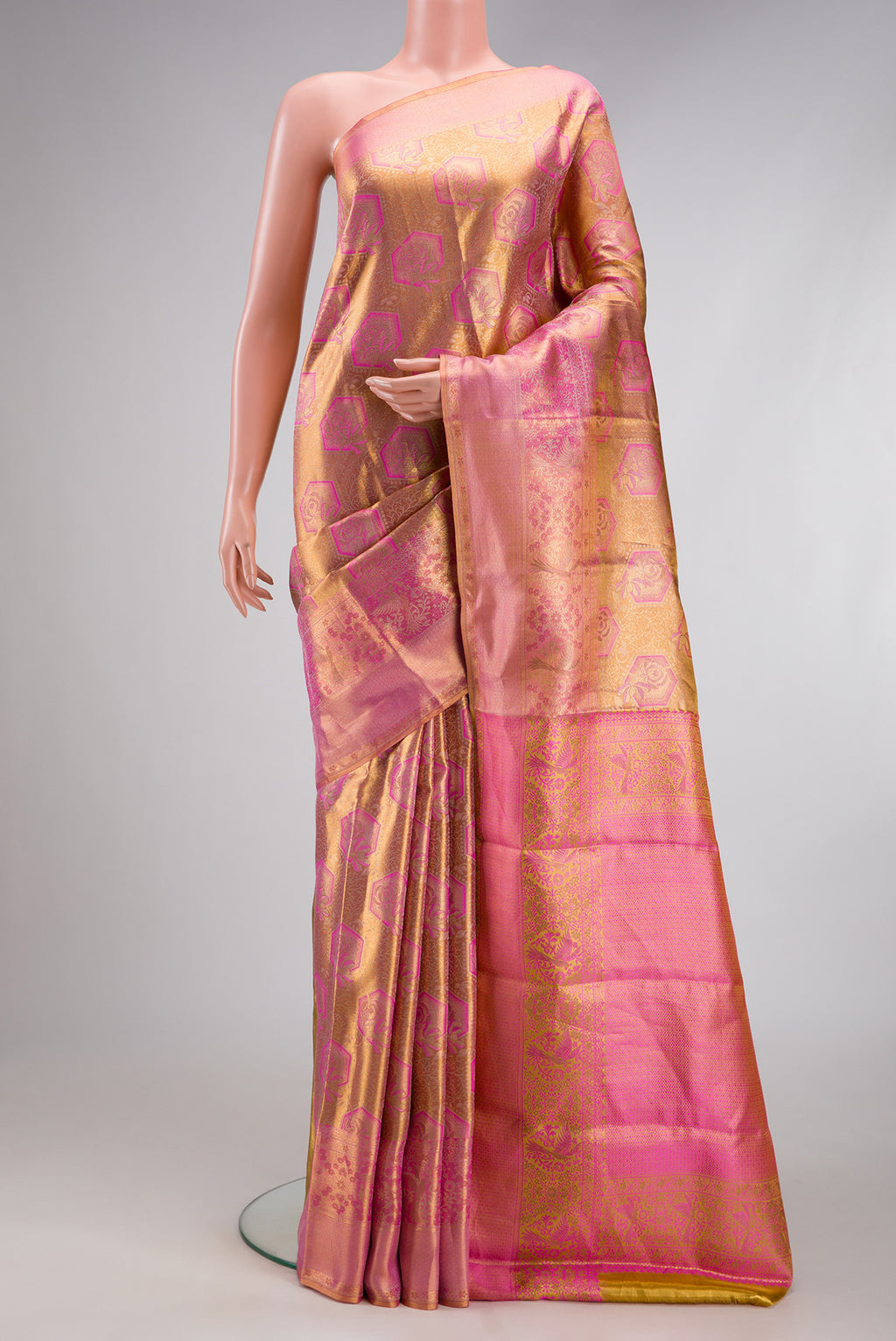 Peach Dual Tone Kanchipuram Tissue Silk Saree with Zari Brocade on the body and Fancy Border.  displayed on a mannequin