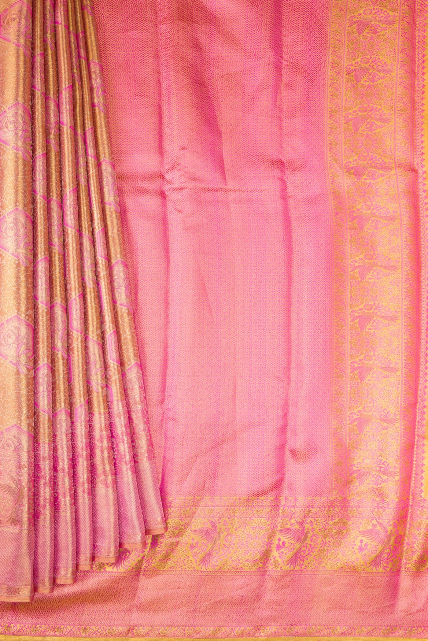 Pleats and pallu of Peach Dual Tone Kanchipuram Tissue Silk Saree with Zari Brocade on the body and Fancy Border. 