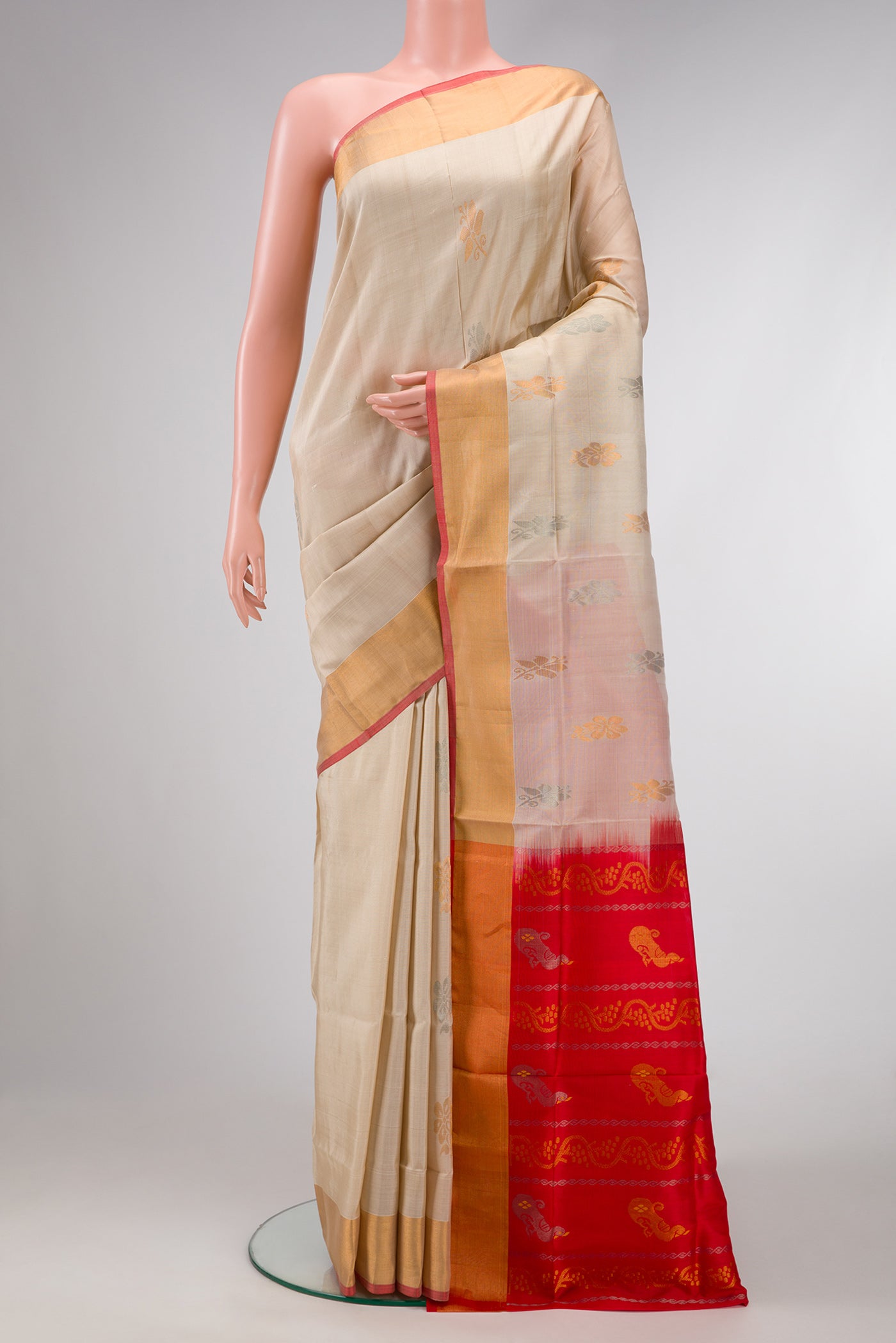 Dark Beige Dual Tone Uppada Silk Saree with Zari Butta on the body and Zari Border.  displayed on a mannequin